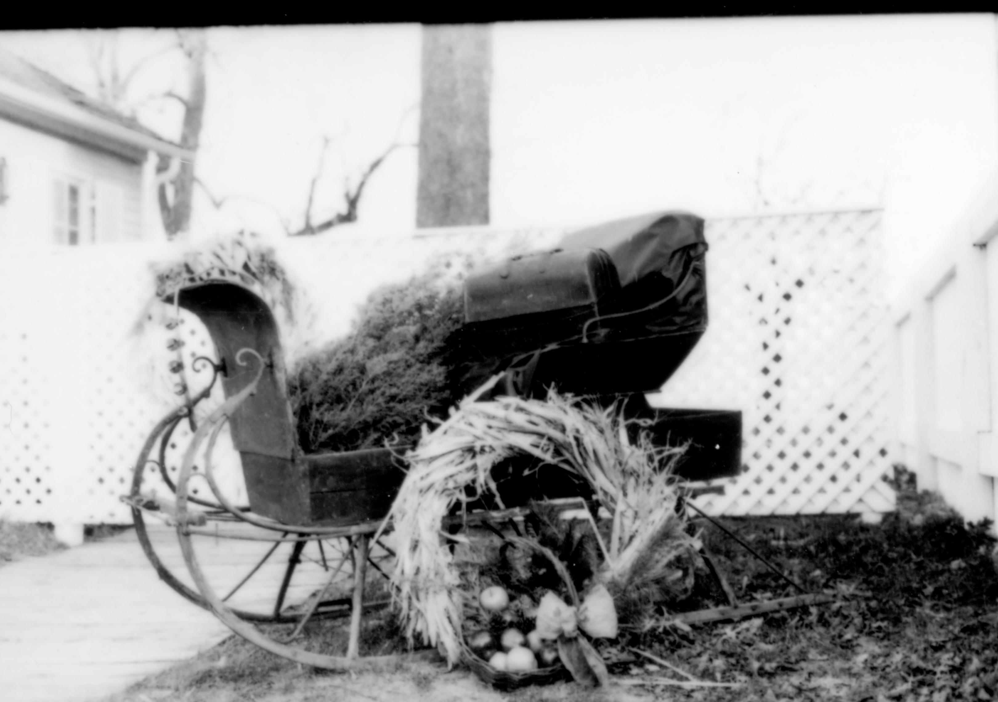 Lincoln Home NHS- Christmas in Lincoln Neighborhood Christmas decor in yard of home in LIHO NHS. Christmas, decorations, sleigh, wreath, decor