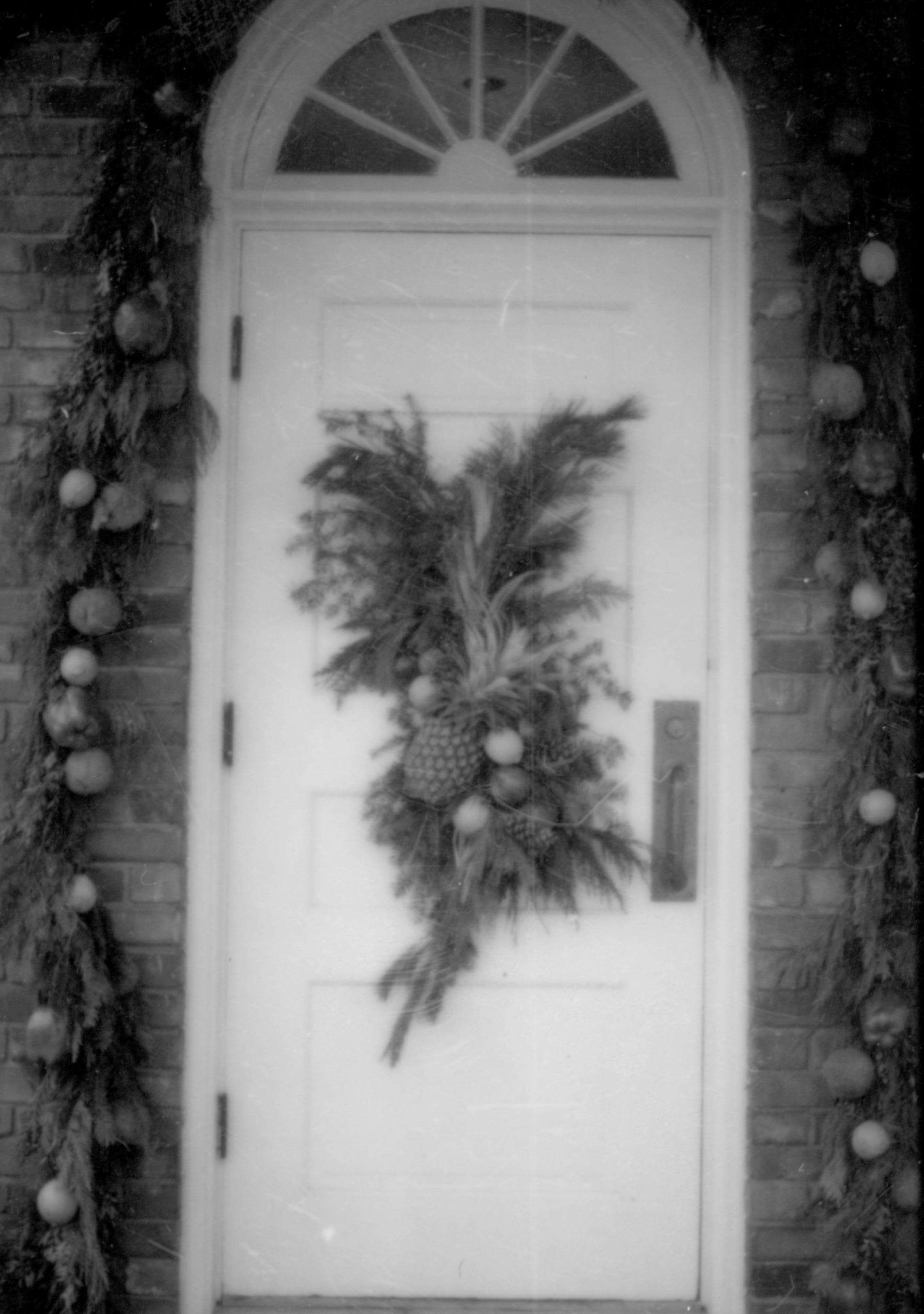 Lincoln Home NHS- Christmas in Lincoln Neighborhood Looking north, Christmas decor on door and surround of Conference Center door. Christmas, decorations, pineapple, wreath, decor, conference, center, garland