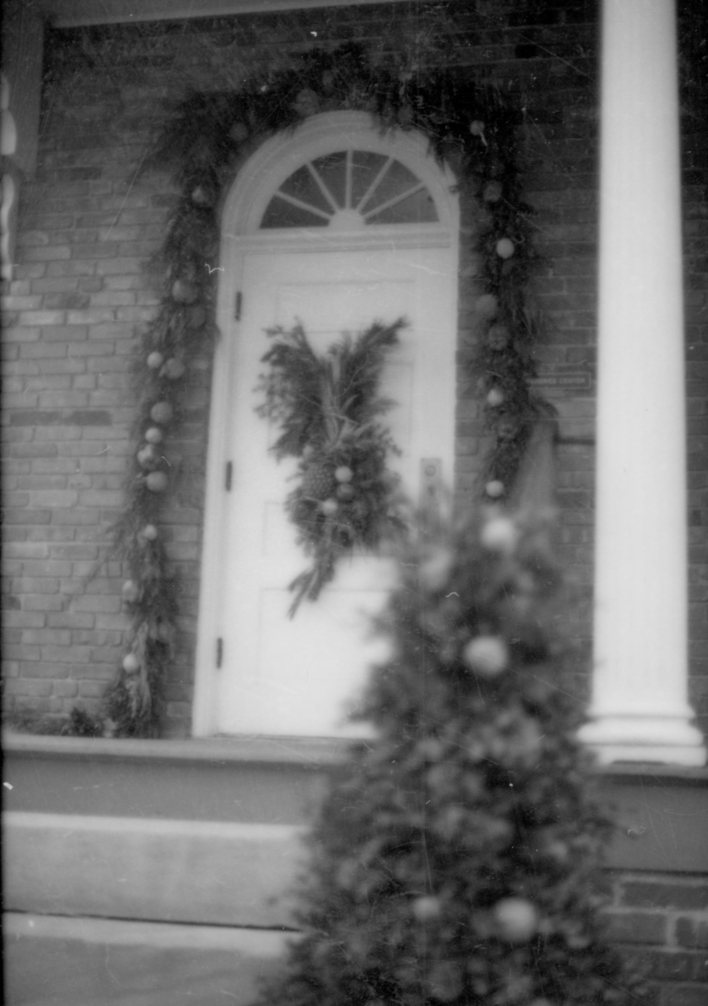 Lincoln Home NHS- Christmas in Lincoln Neighborhood Looking north east, Christmas decor on porch and walk of Conference Center. Christmas, decorations, neighborhood, wreath, garland, tree, conference, center