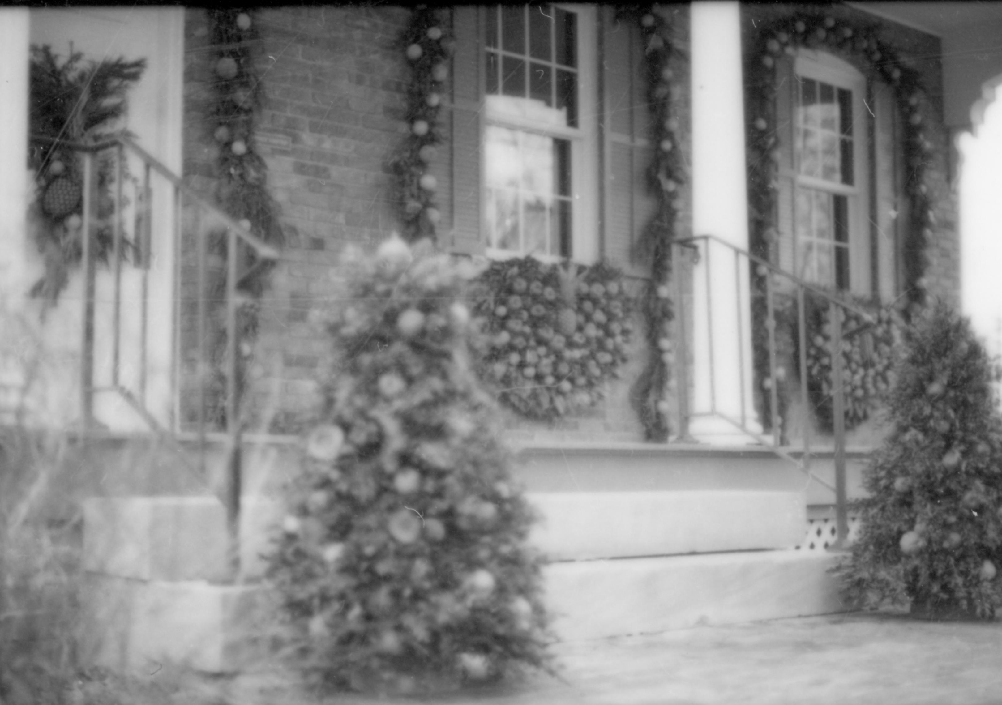 Lincoln Home NHS- Christmas in Lincoln Neighborhood Looking south east, Christmas decor on porch and walk of Conference Center. Christmas, decorations, neighborhood, conference, center, tree, garland, wreath, decor