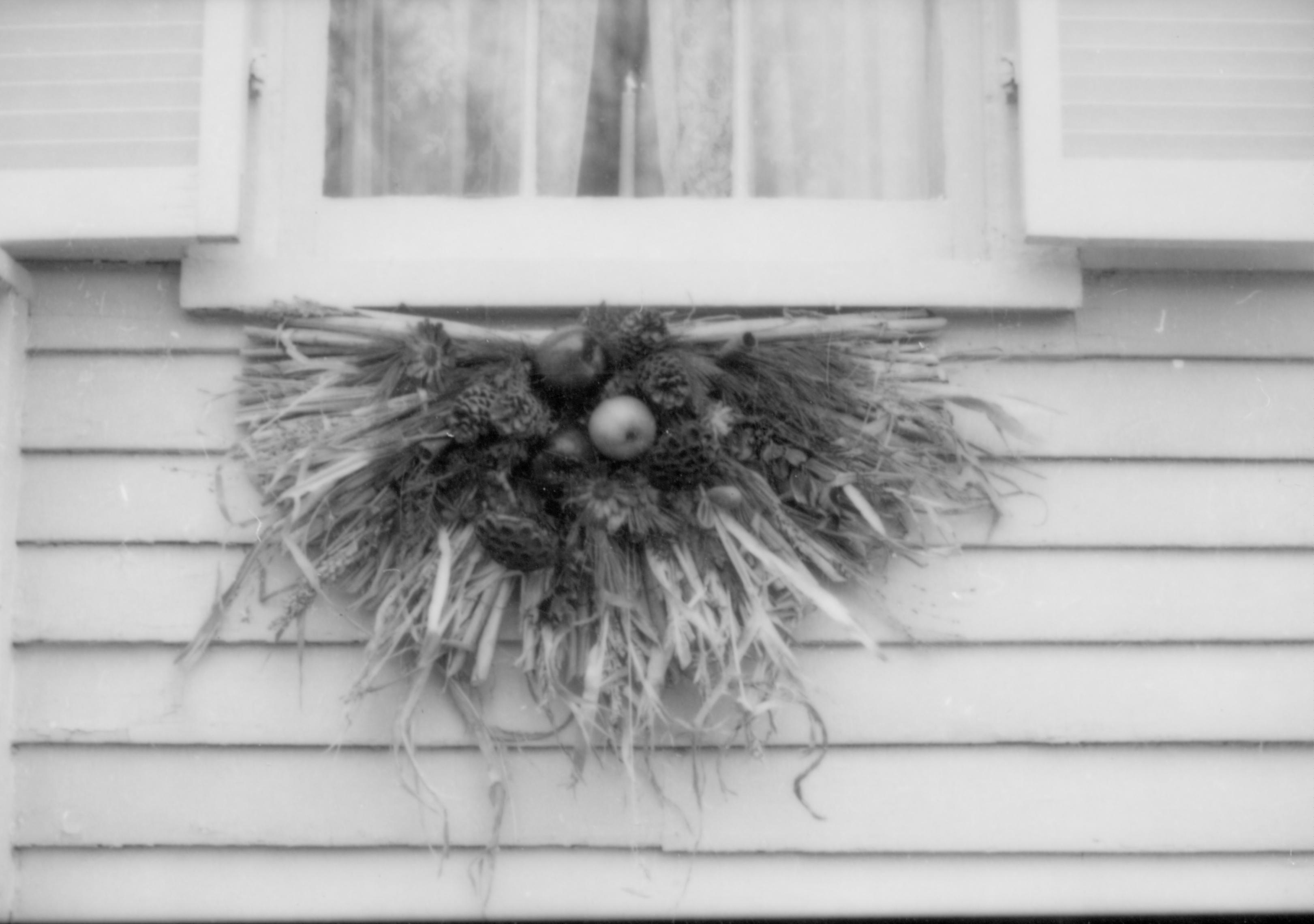 Lincoln Home NHS- Christmas in Lincoln Neighborhood Looking east, Christmas decor on window sill of Corneau (?) house. Detail. Christmas, decorations, neighborhood, Corneau, detail, wreath