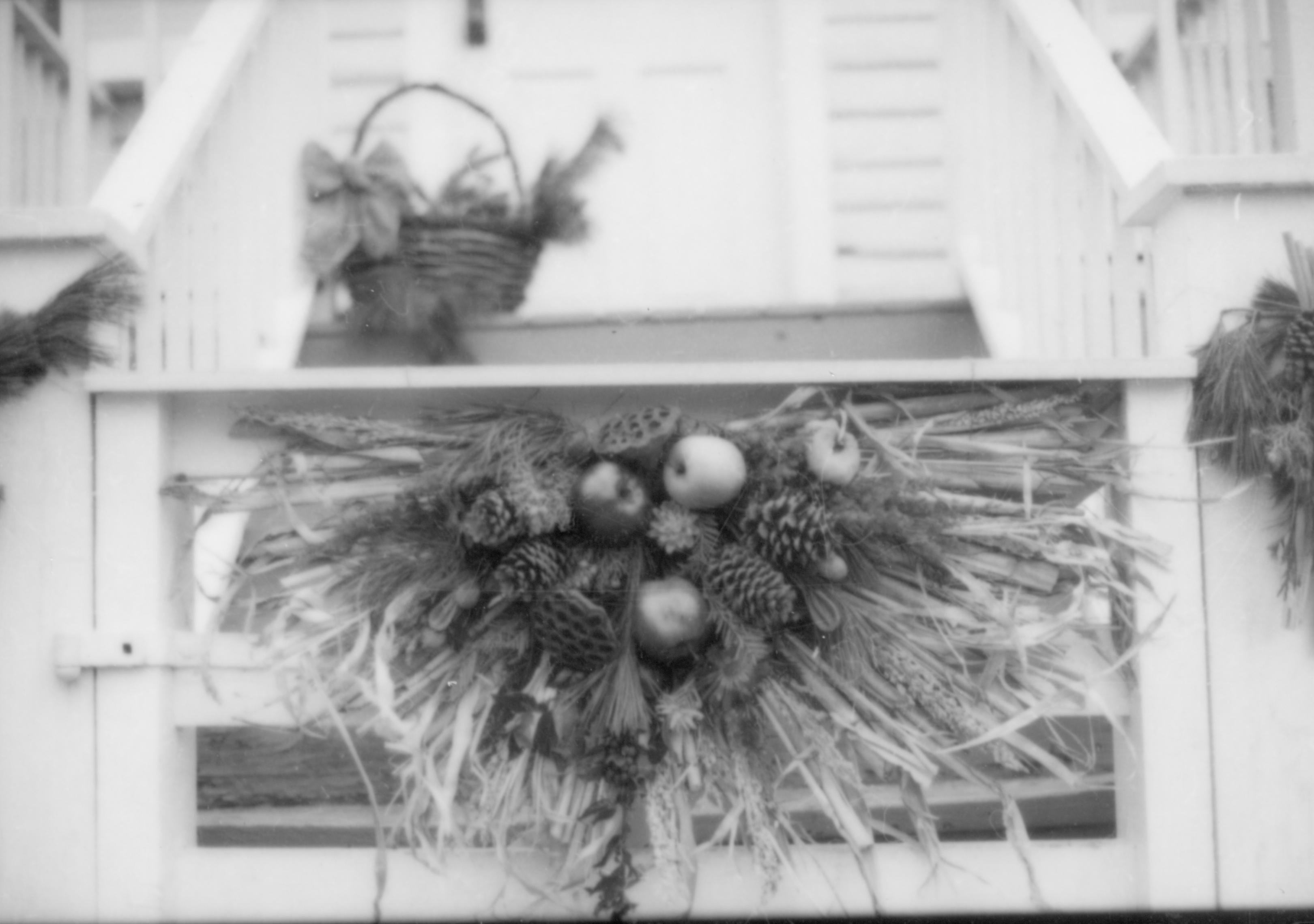 Lincoln Home NHS- Christmas in Lincoln Neighborhood Looking east, Christmas decor on gate of Corneau house, porch in background. Detail. Christmas, decorations, neighborhood, wreath, decor, fence, detail, Corneau