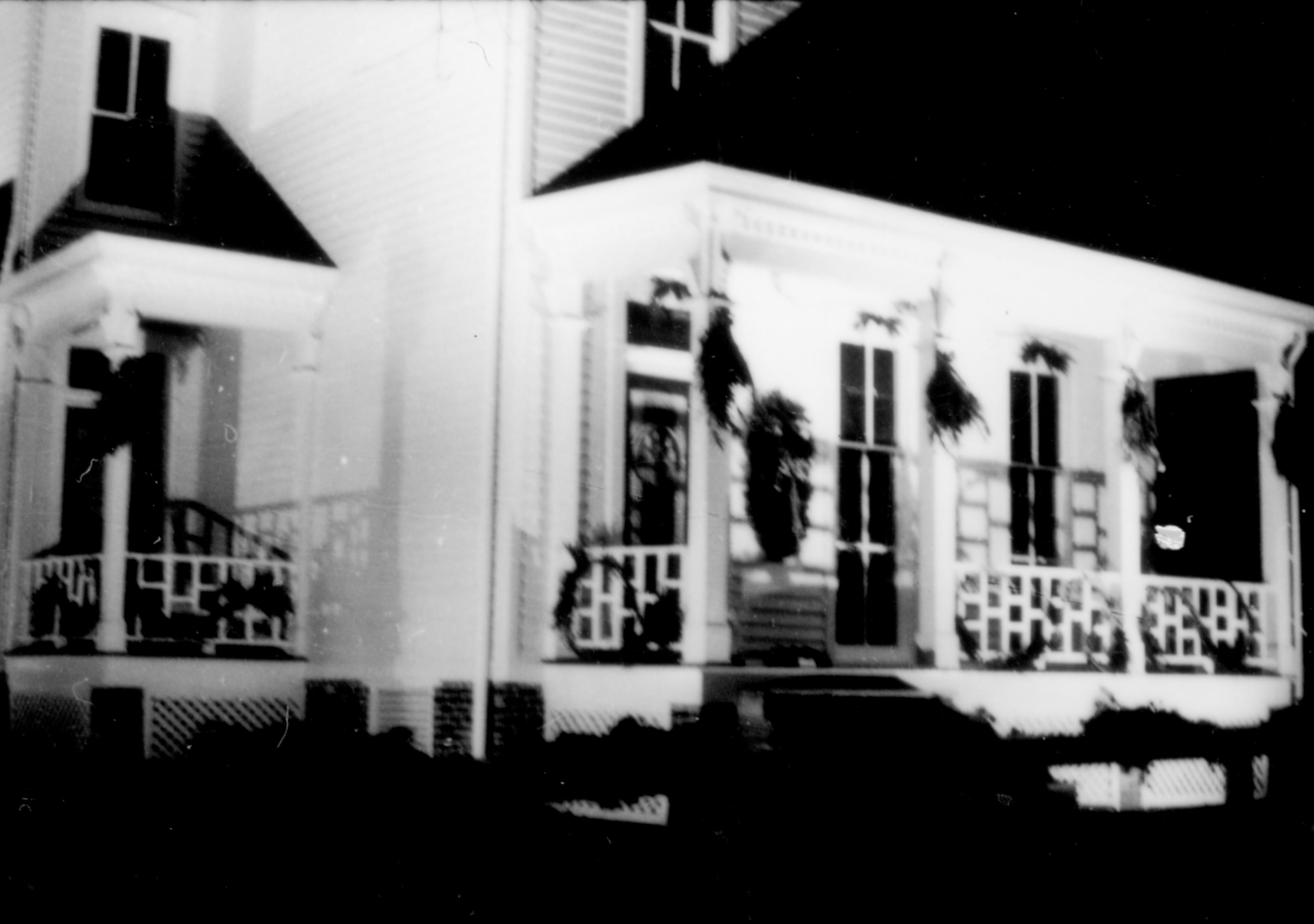 Lincoln Home NHS- Christmas in Lincoln Neighborhood Looking north west from 8th Street, Shutt house decorated for Christmas. Shutt, neighborhood, night, Christmas, decor, wreath, garland, porch