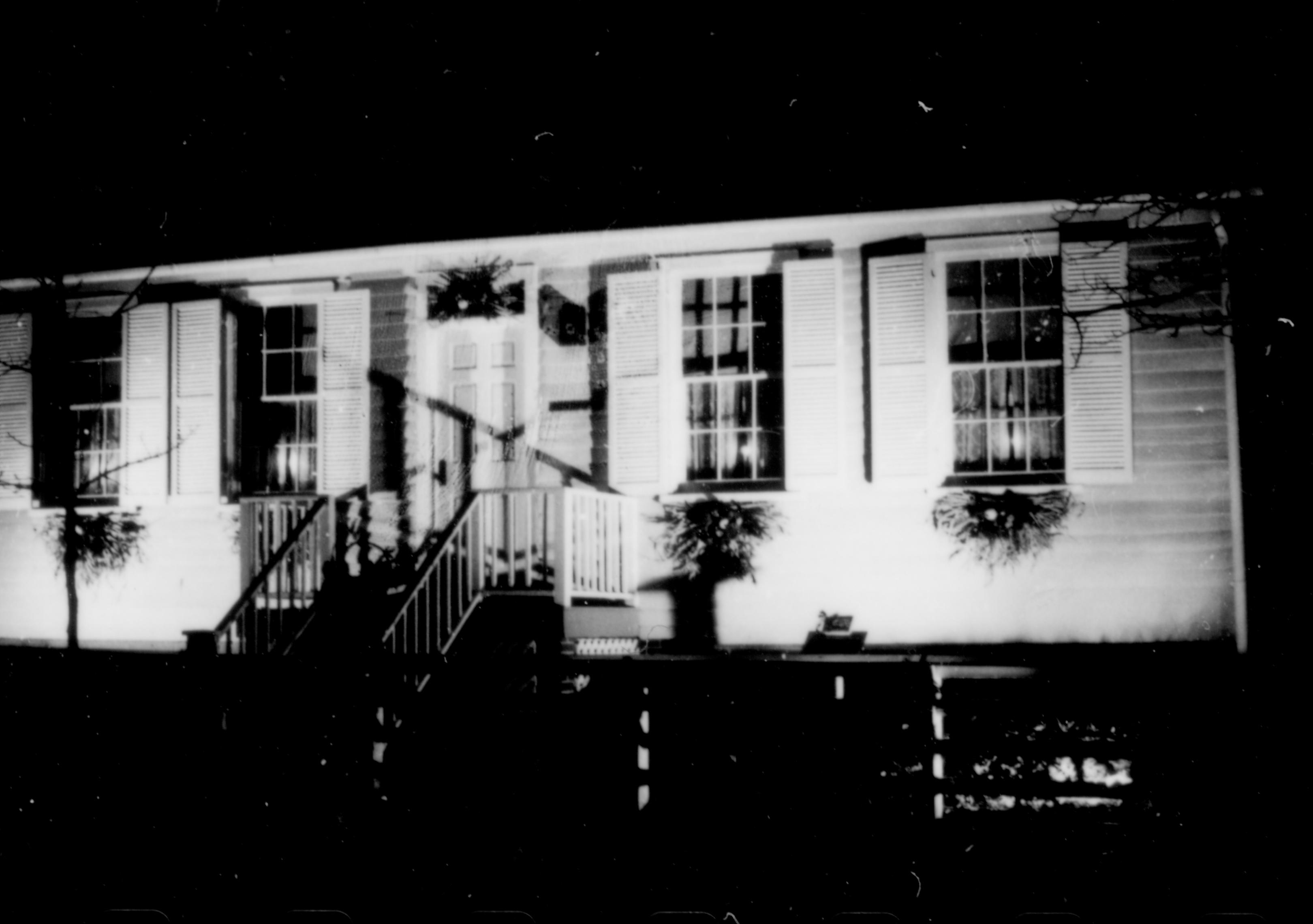 Lincoln Home NHS- Christmas in Lincoln Neighborhood Looking east from 8th Street, west face of Corneau house decorated for Christmas. neighborhood, night, Christmas, Corneau, decor, wreath, garland