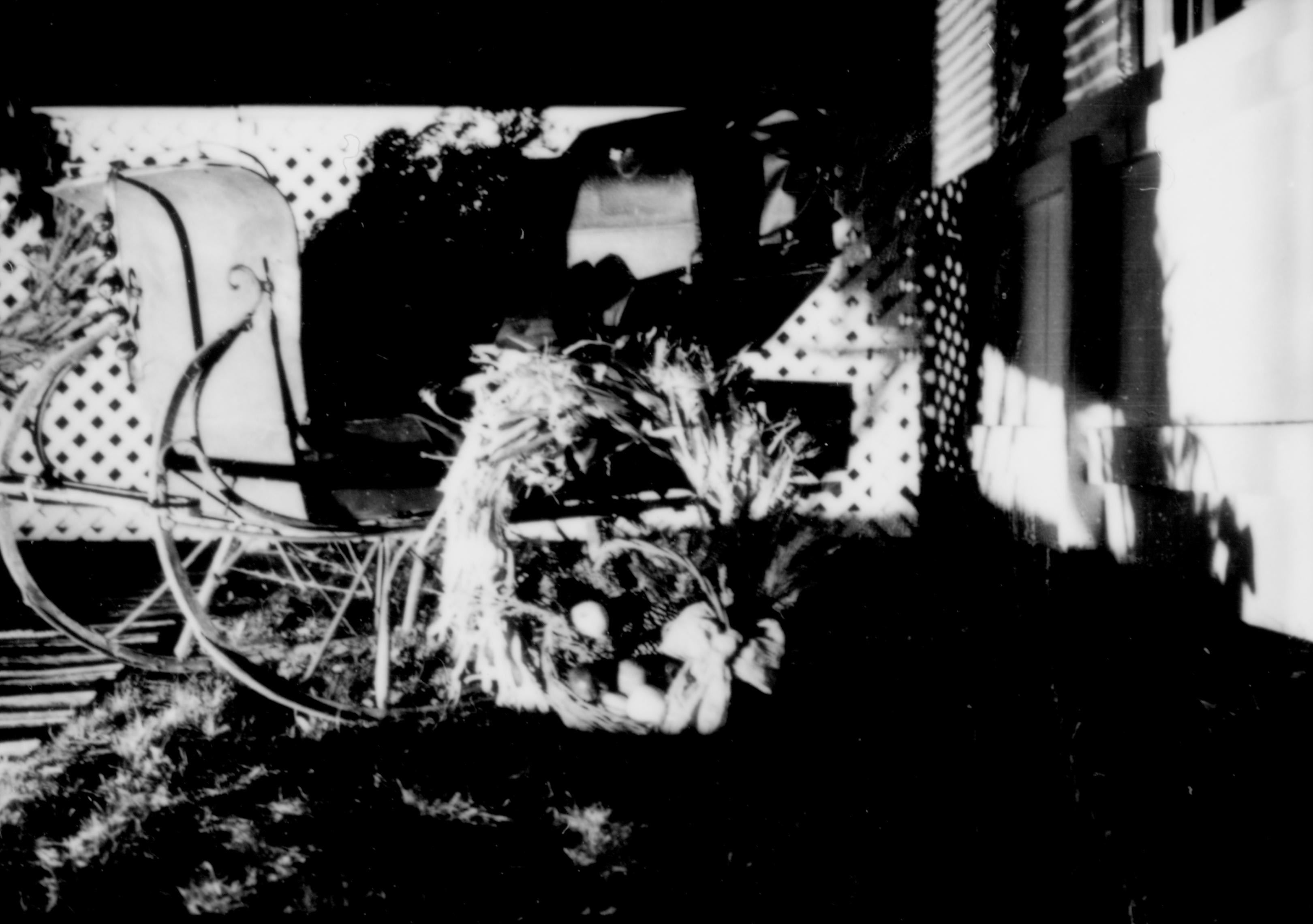 Lincoln Home NHS- Christmas in Lincoln Neighborhood Looking north, Christmas decor on porch of Corneau house. neighborhood, night, Christmas, sleigh, Corneau, wreath, garland, porch