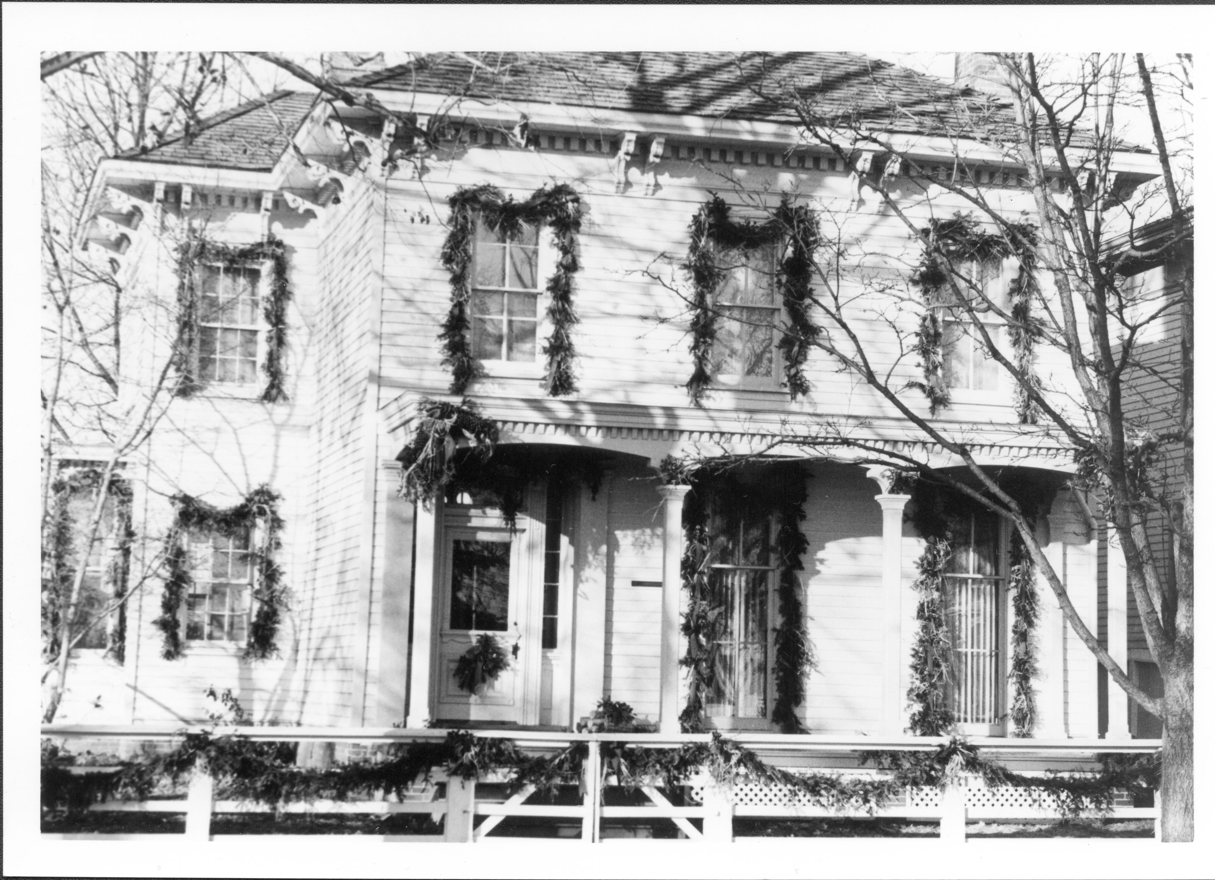 Lincoln Home NHS- Christmas in Lincoln Neighborhood Looking west from 8th street, Rosenwald house decorated for Christmas. Christmas, neighborhood, Lyon, Rosenwald, garland, wreath, porch, fence