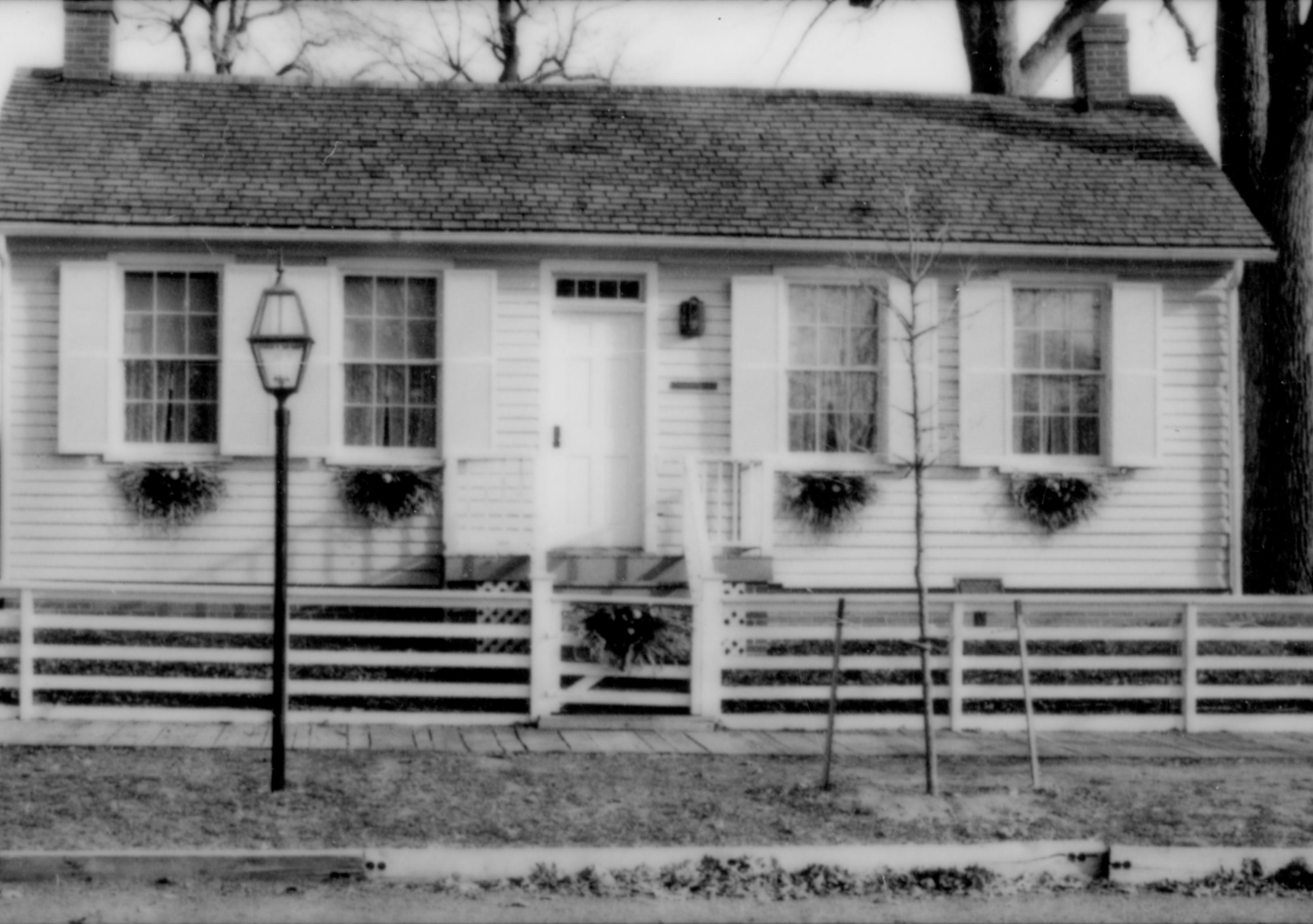 Lincoln Home NHS- Christmas in Lincoln Neighborhood Looking east, Corneau house decorated for Christmas. Christmas, neighborhood, decorations, decor, fence, porch, wreath