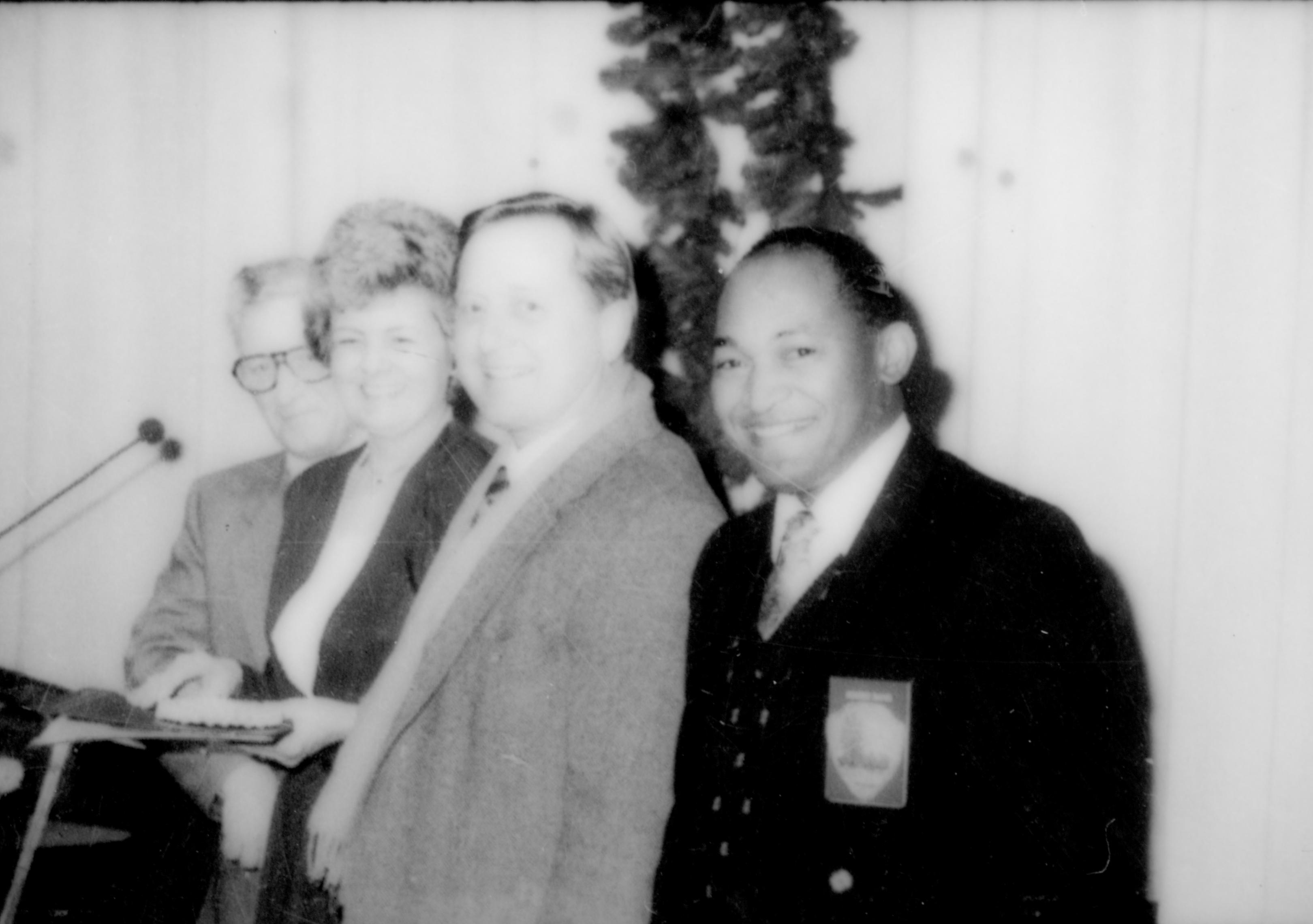 Lincoln Home NHS- Christmas in Lincoln Neighborhood Looking east (?), VIPs posing for photograph in Visitor Center Theater 1. Christmas, ceremony, theater, VIP, Visitor, Center