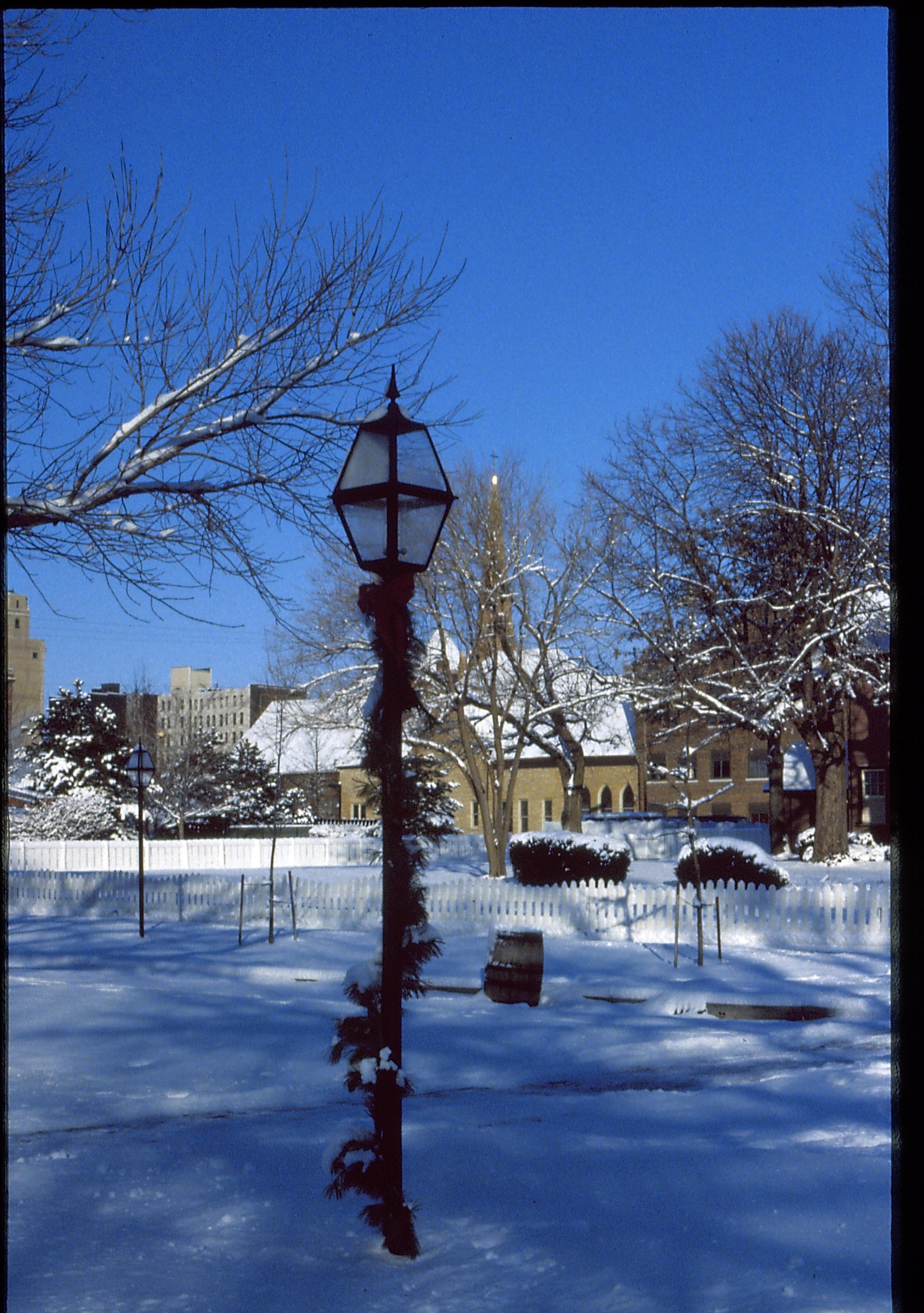 Lincoln Home NHS- Christmas in Lincoln Neighborhood Looking north west from 8th and Jackson, light post decorated with garland. Christmas, decorations, snow, light, post, garland, decor