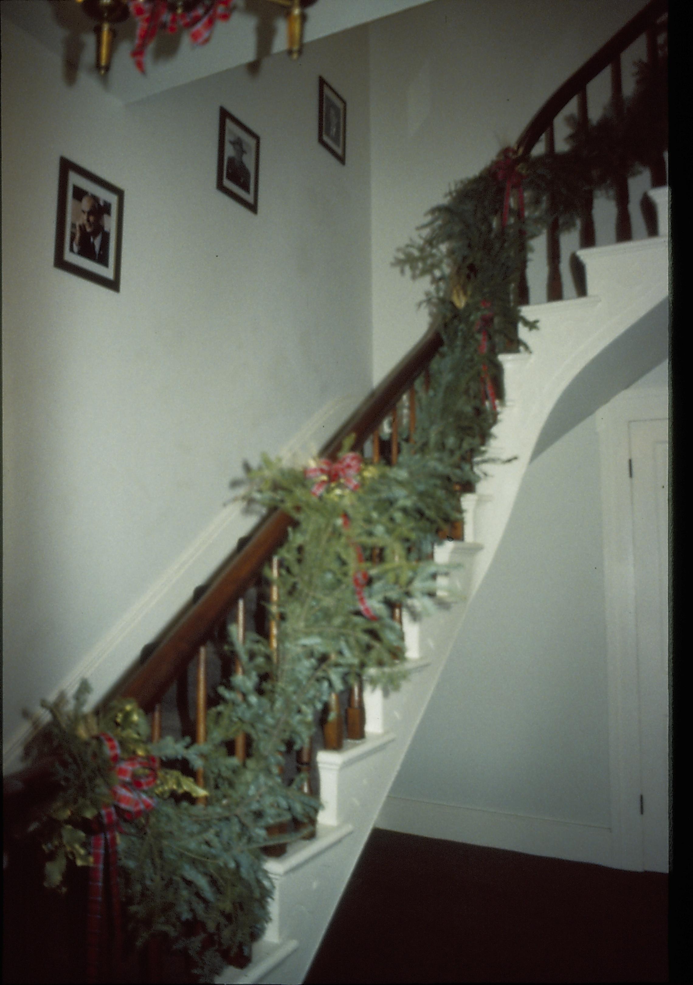 Lincoln Home NHS- Christmas in Lincoln Neighborhood Looking west from doorway, Rosenwald (?) house stairwell handrail decorated for Christmas. Christmas, decorations, garland, handrail, Rosenwald, Lyon