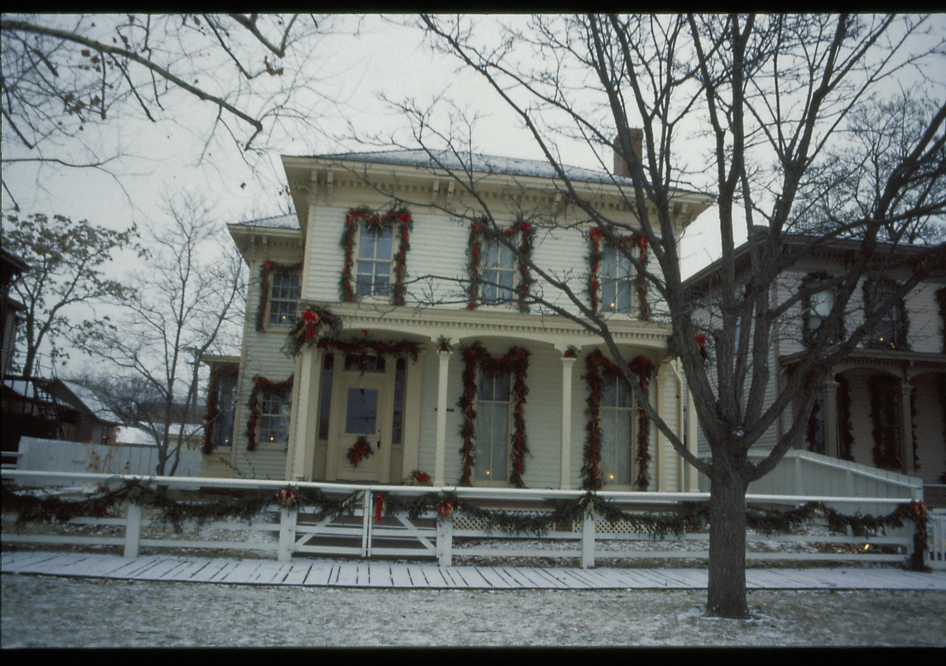 Lincoln Home NHS- Christmas in Lincoln Neighborhood Looking west from 8th Street, Rosenwald house decorated for Christmas. Christmas, decorations, Rosenwald, Lyon, wreath, garland