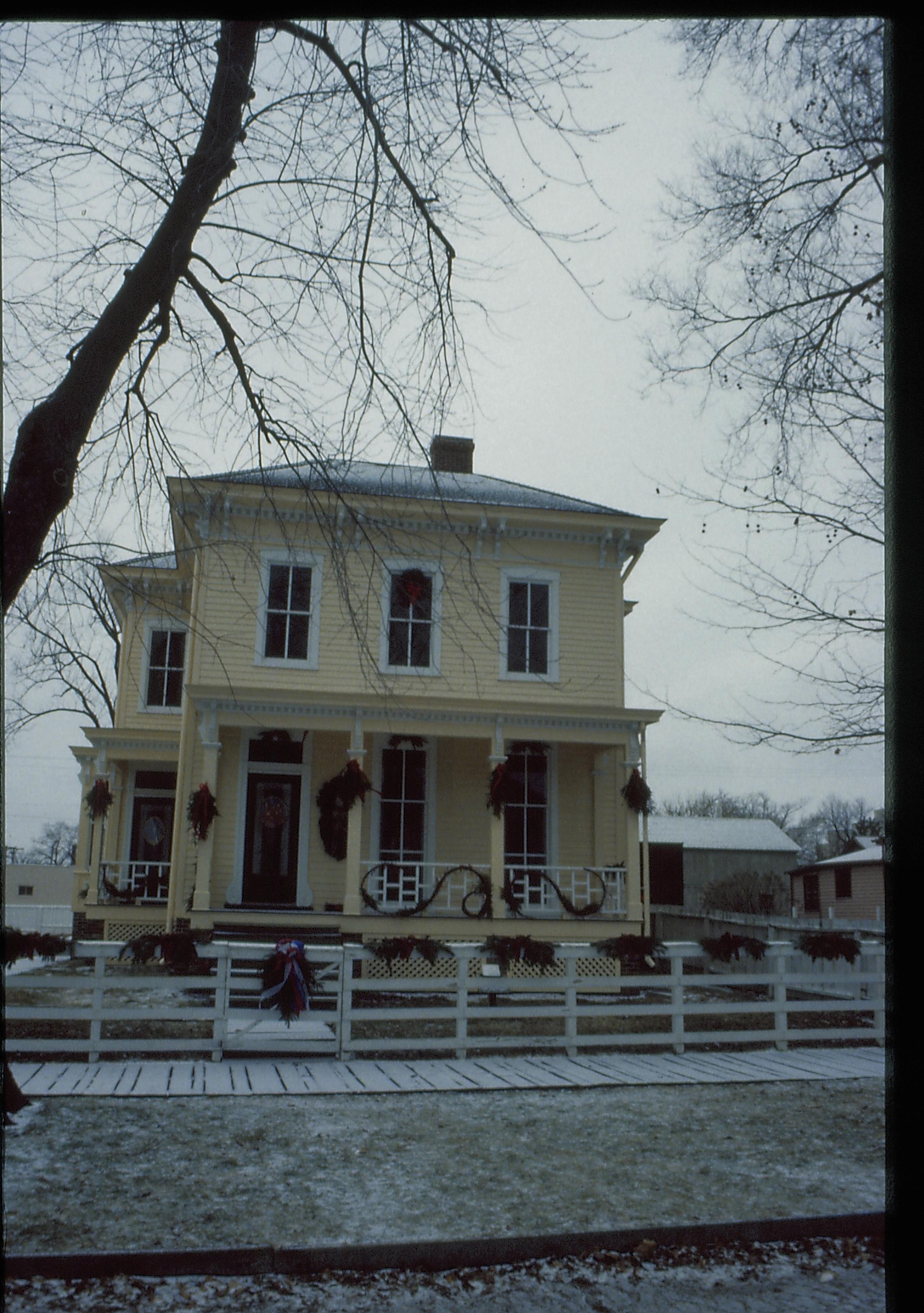 Lincoln Home NHS- Christmas in Lincoln Neighborhood Looking west from 8th Street, Shutt house decorated for Christmas. Christmas, decorations, decor, Shutt, wreath, snow, garland, 