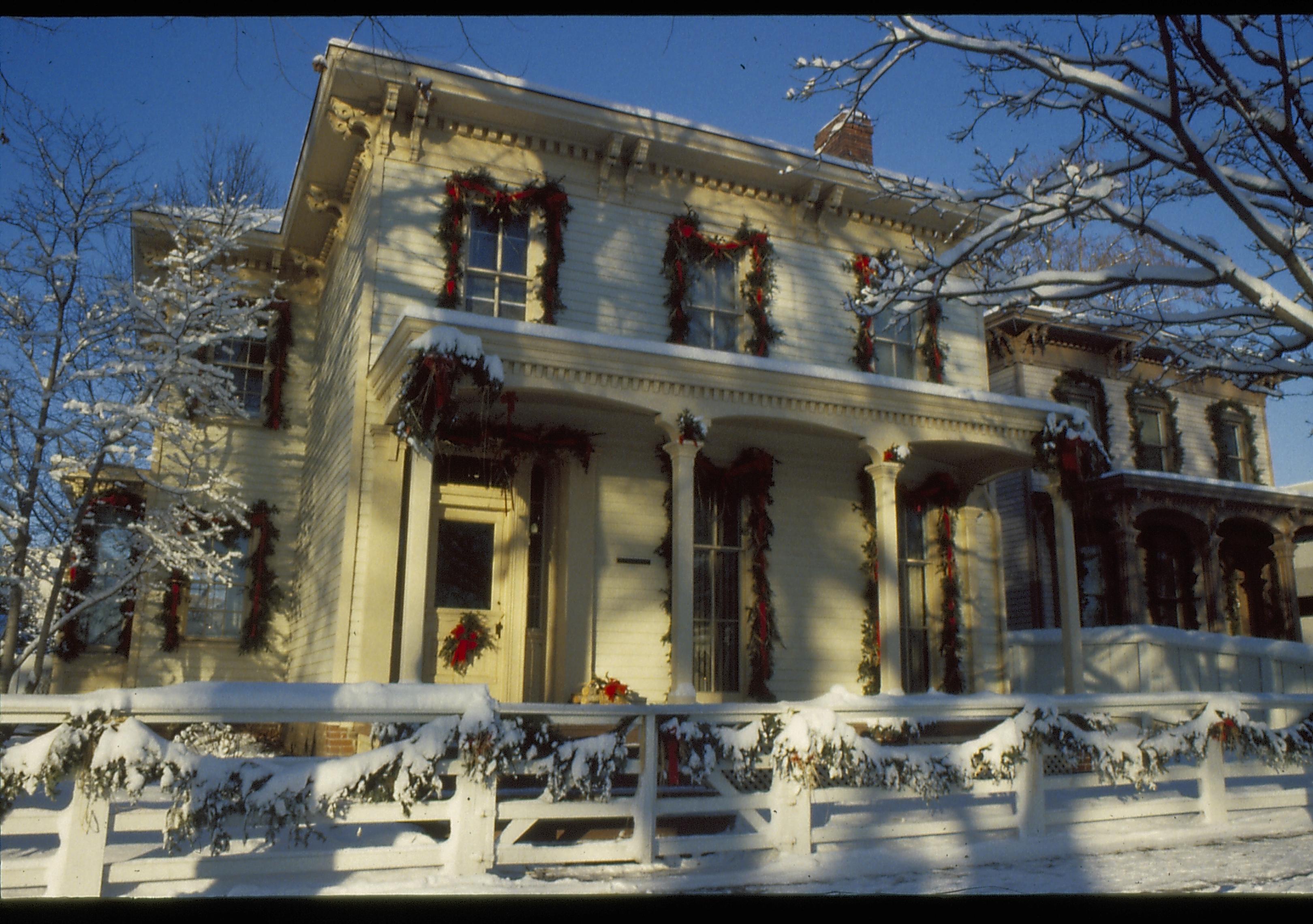 Lincoln Home NHS- Christmas in Lincoln Neighborhood Looking west from 8th Street, Rosenwald house decorated for Christmas. Christmas, decorations, decor, Rosenwald, Lyon, wreath, garland, snow