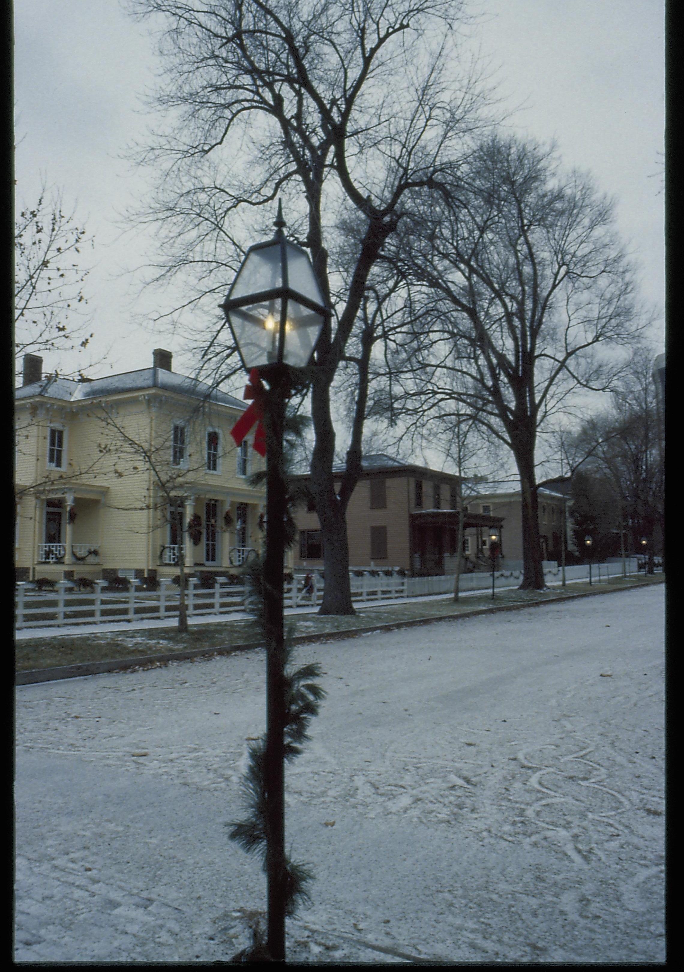 Lincoln Home NHS- Christmas in Lincoln Neighborhood Looking north west down 8th Street, light post with garland. Shutt, Dubois, Miller in bacskground. Christmas, decorations, garland, post, Dubois, Shutt, Miller, decor