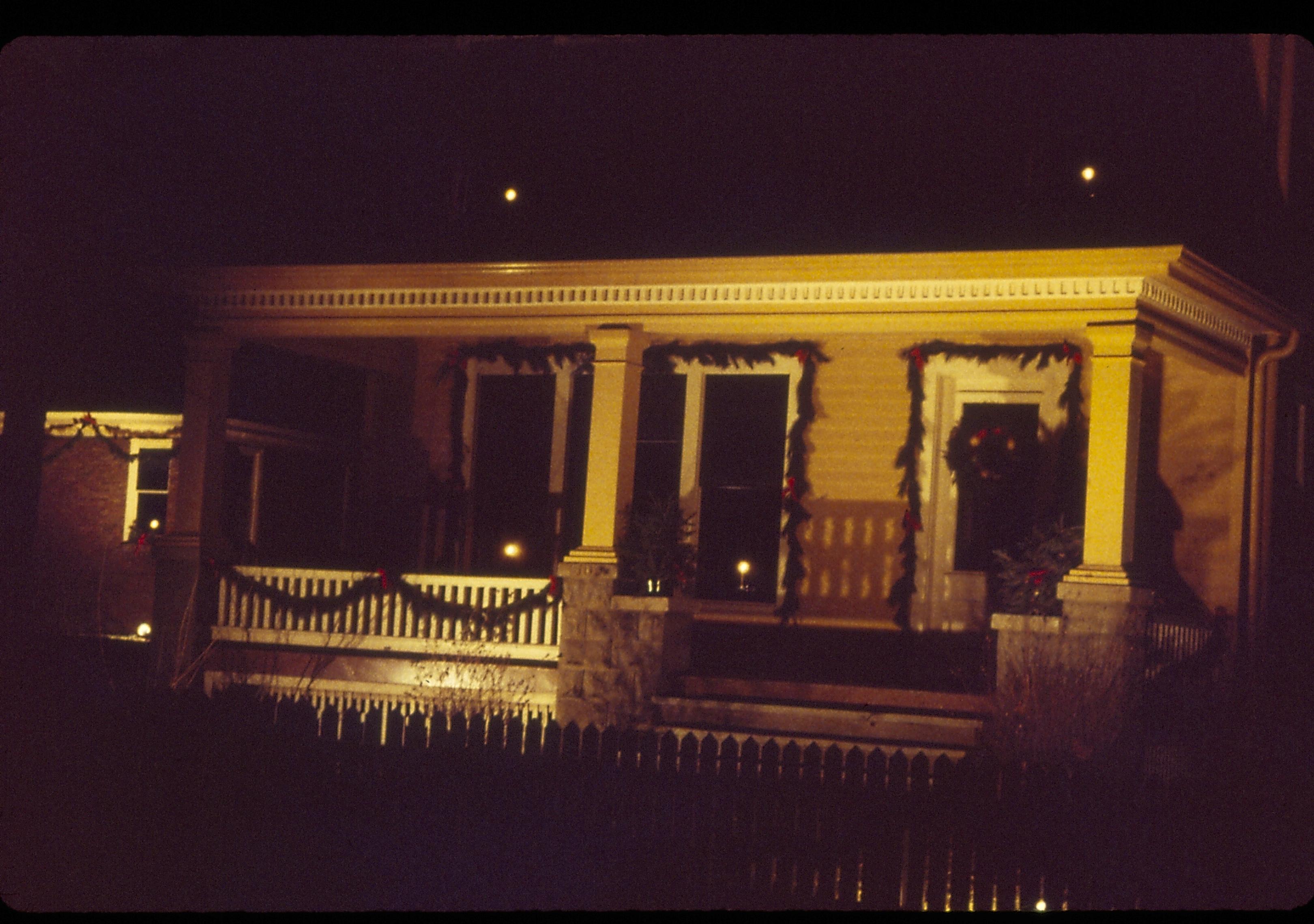 Lincoln Home NHS- Christmas in Lincoln Neighborhood Looking north east from 8th Street, Cook house decorated for Christmas. Night. Christmas, decorations, night, wreath, garland, Cook