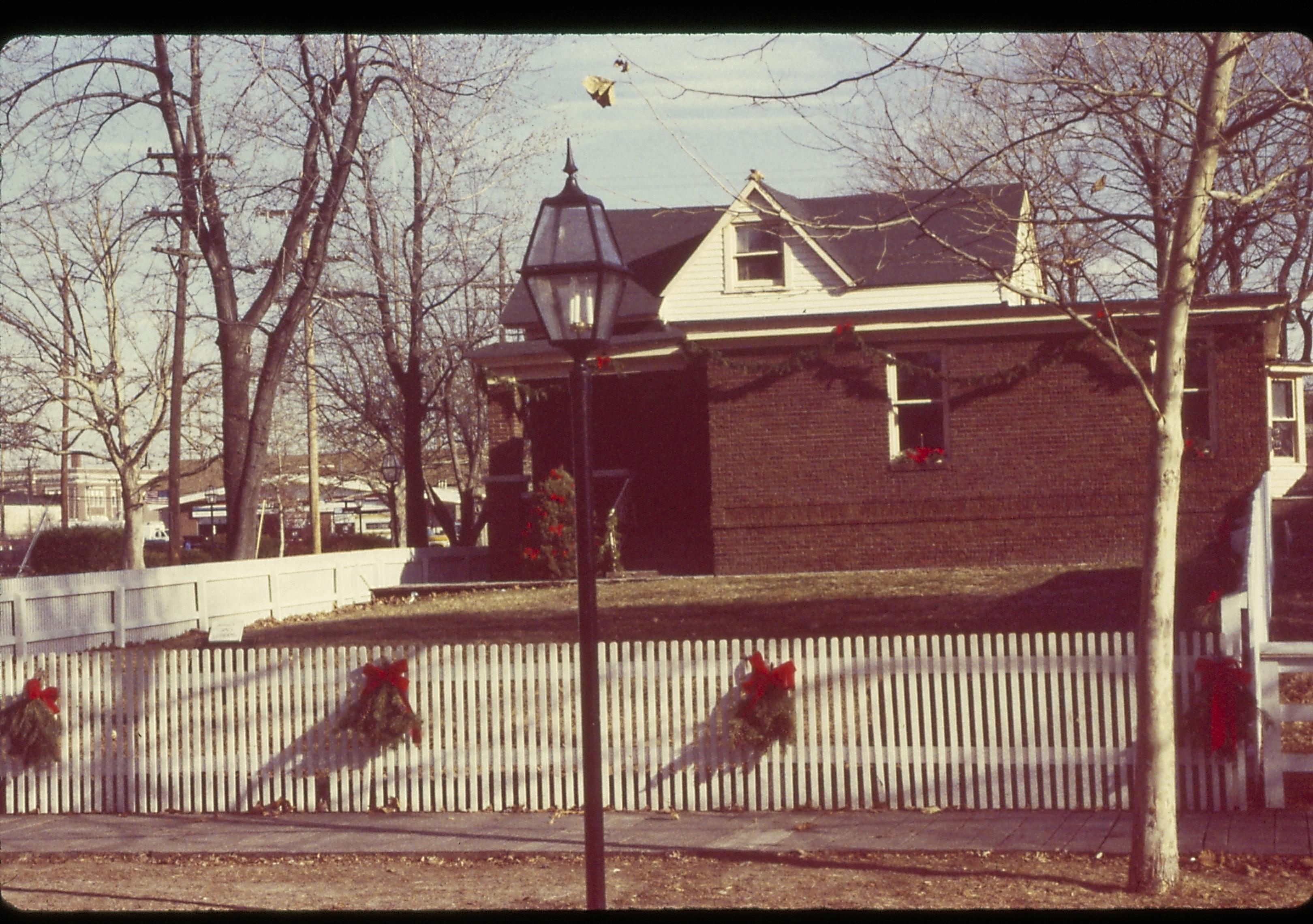 Lincoln Home NHS- Christmas in Lincoln Neighborhood Looking east from 8th Street, the Arnold house decorated for Christmas. Christmas, decorations, Arnold, wreath, garland