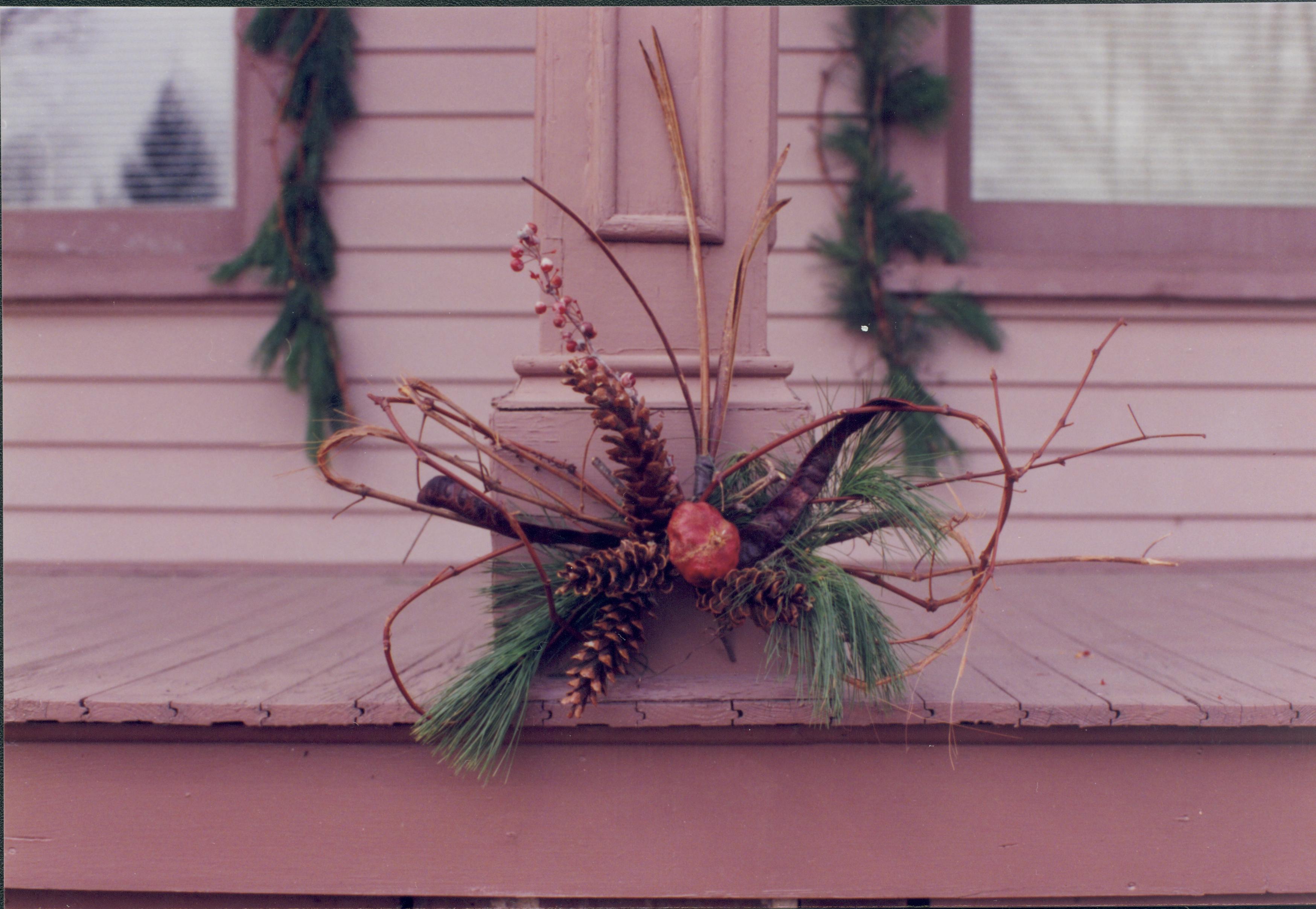 Lincoln Home NHS- Christmas in Lincoln Neighborhood Looking west toward Beedle house porch. Detail of wreath on porch column. Christmas, neighborhood, Beedle, decoration, detail