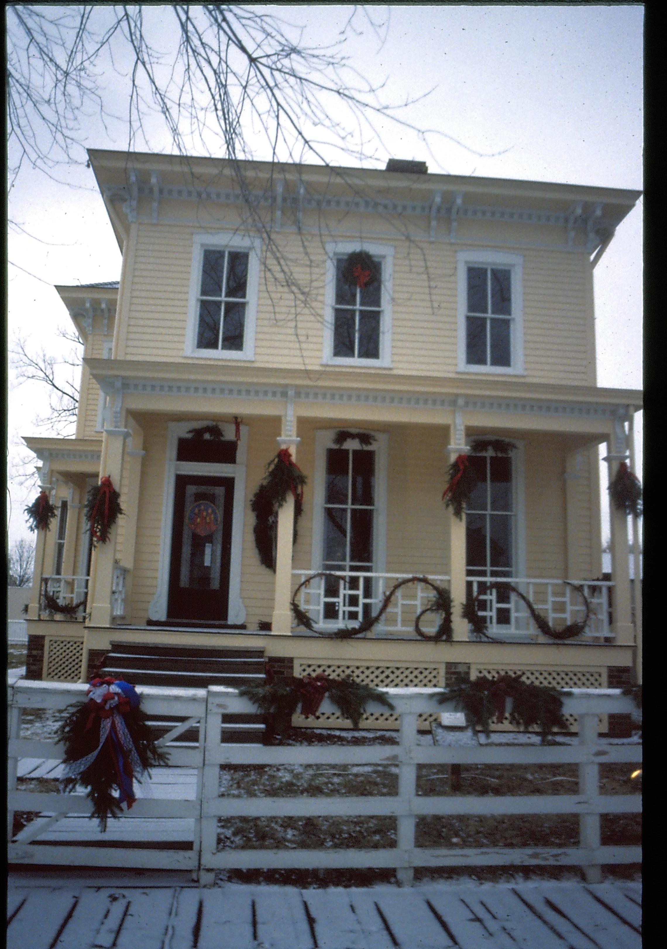 Lincoln Home NHS- Christmas in Lincoln Neighborhood Looking west from boardwalk, Shutt house decorated for Christmas. Christmas, decorations, wreath, garland, Shutt, decor