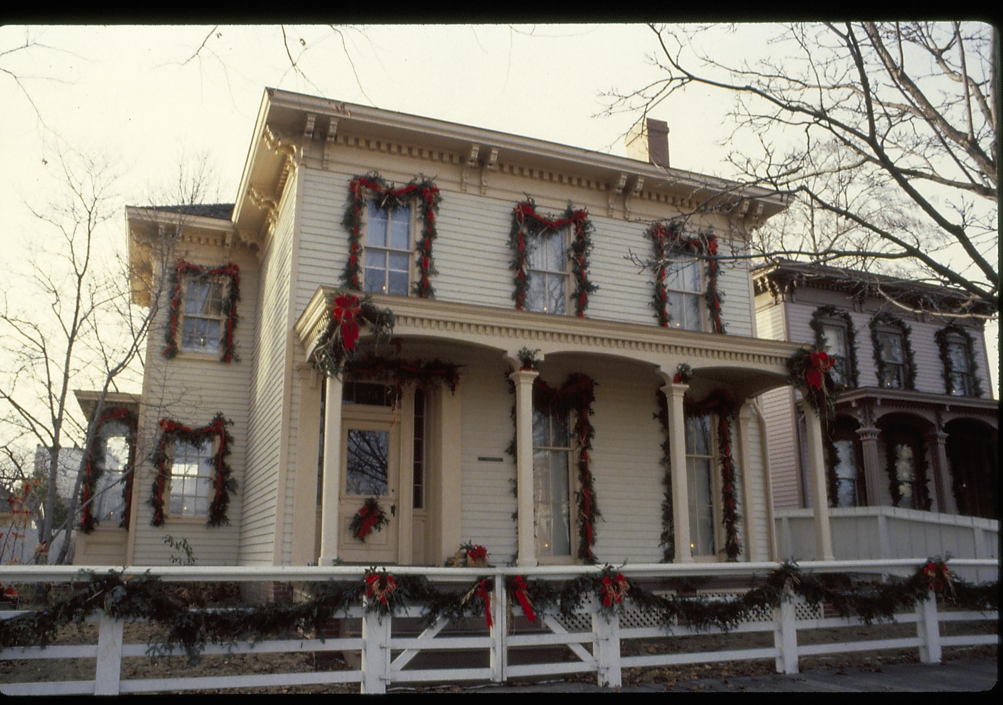 Lincoln Home NHS- Christmas in Lincoln Neighborhood Looking west from 8th Street, Rosenwald house and fence decorated for Christmas. Christmas, decorations, Lyon, Rosenwald, decor, wreath, garland, fence