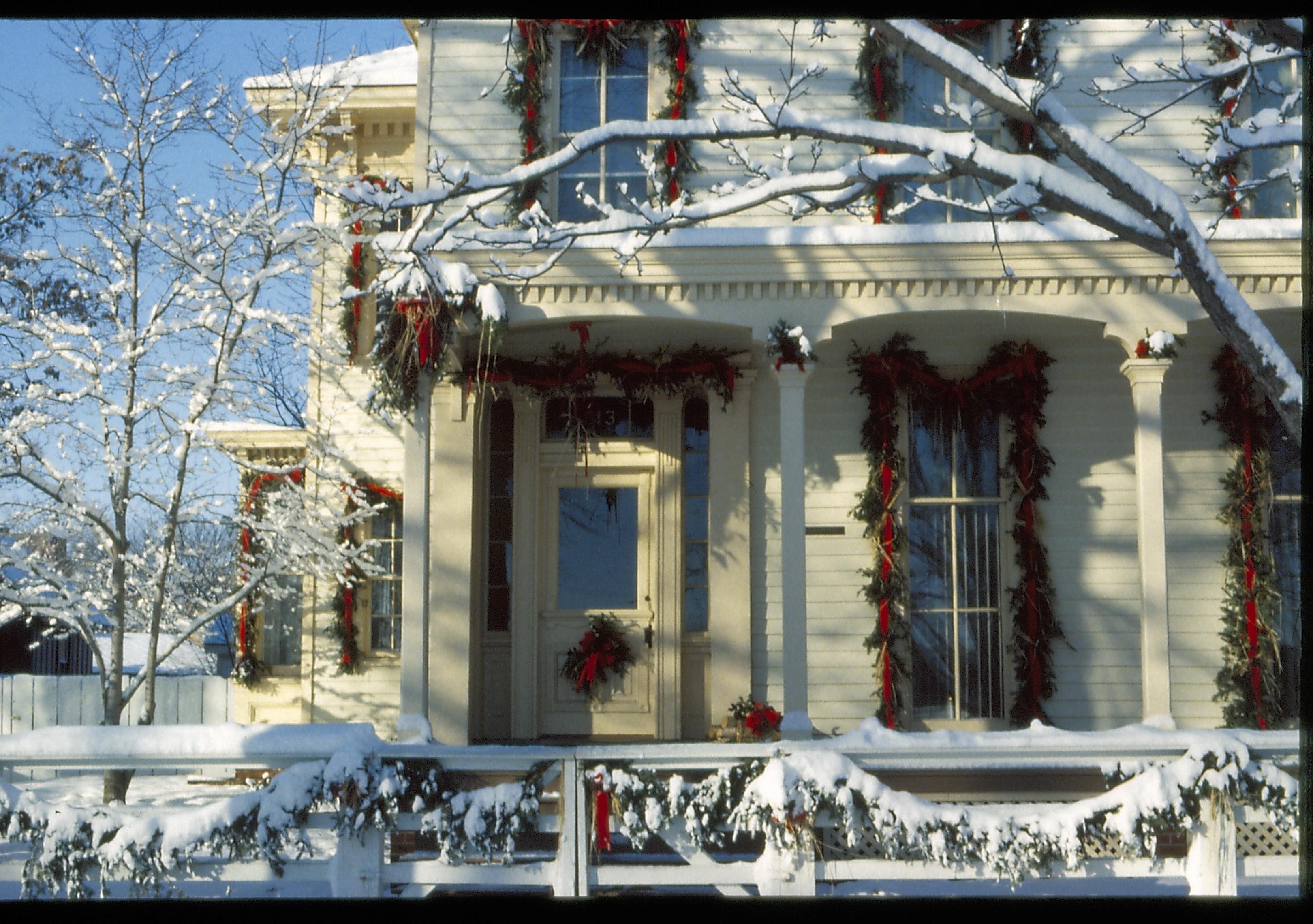 Lincoln Home NHS- Christmas in Lincoln Neighborhood Looking west from 8th Street, Rosenwald house and fence decorated for Christmas. Detal. Christmas, decorations, decor, Lyon, Rosenwald, fence, garland, wreath, snow