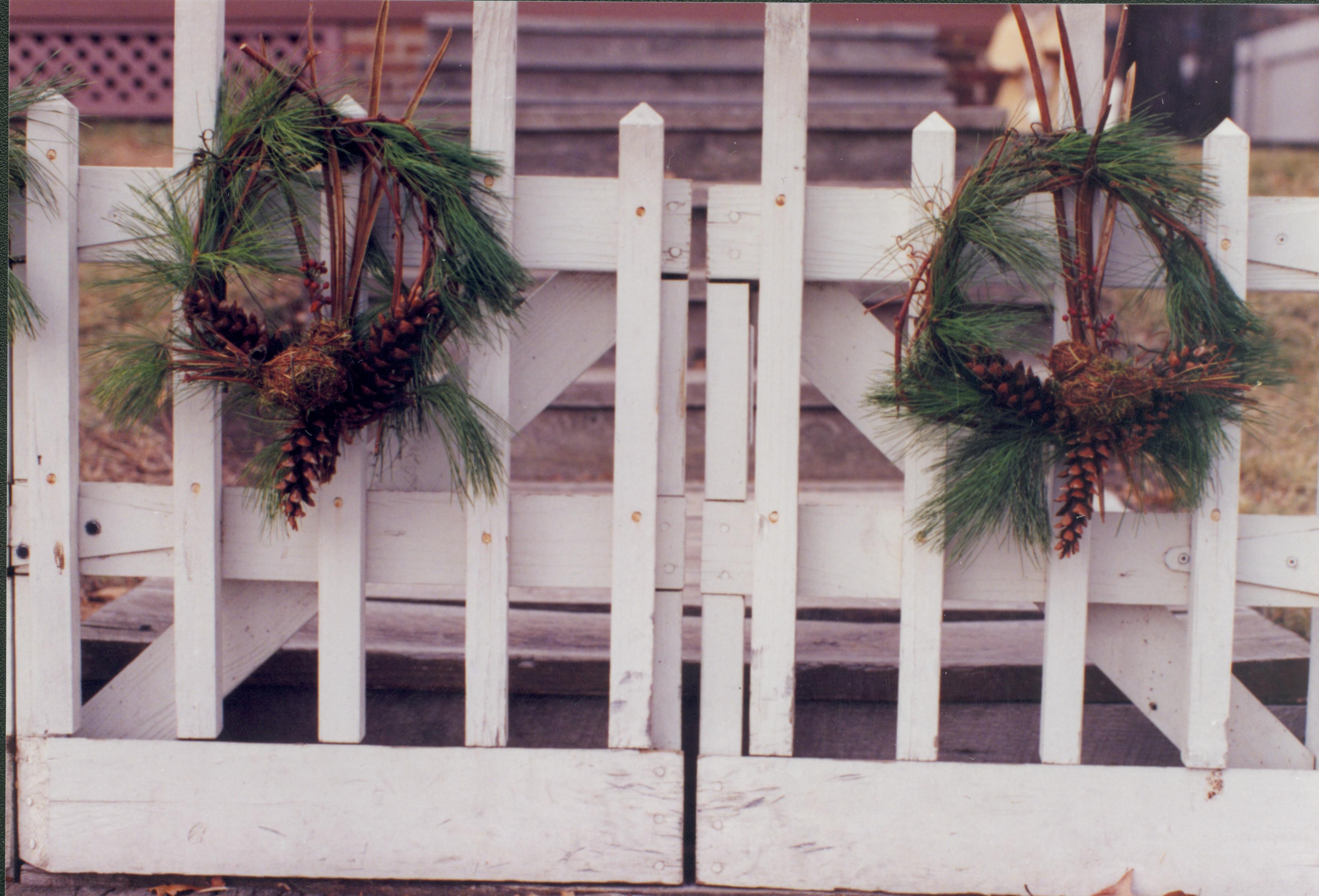 Lincoln Home NHS- Christmas in Lincoln Neighborhood Looking west from 8th Street boardwalk toward east gate of Beedle house. Detail. of wreath on gate. Christmas, neighborhood, wreath, decoration, Beedle, gate