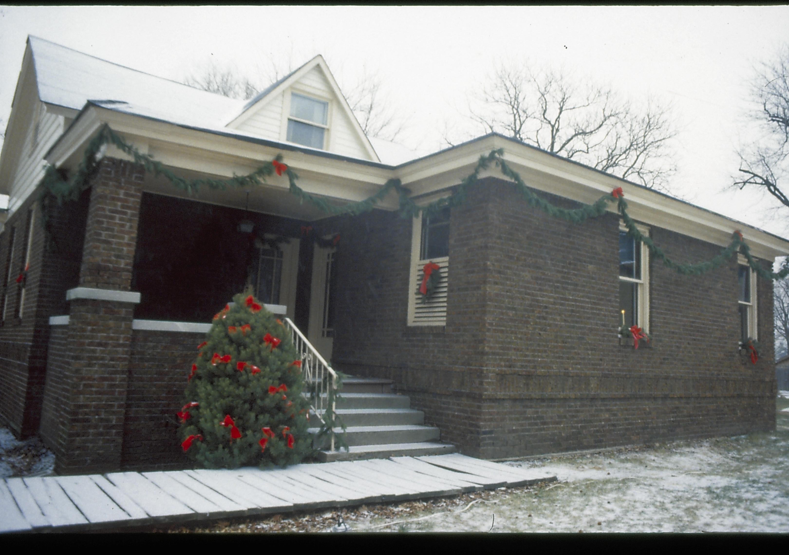 Lincoln Home NHS- Christmas in Lincoln Neighborhood Looking east from yard, Arnold House decorated for Christmas. Detail. Christmas, decorations, snow, decor, wreath, garland, Arnold