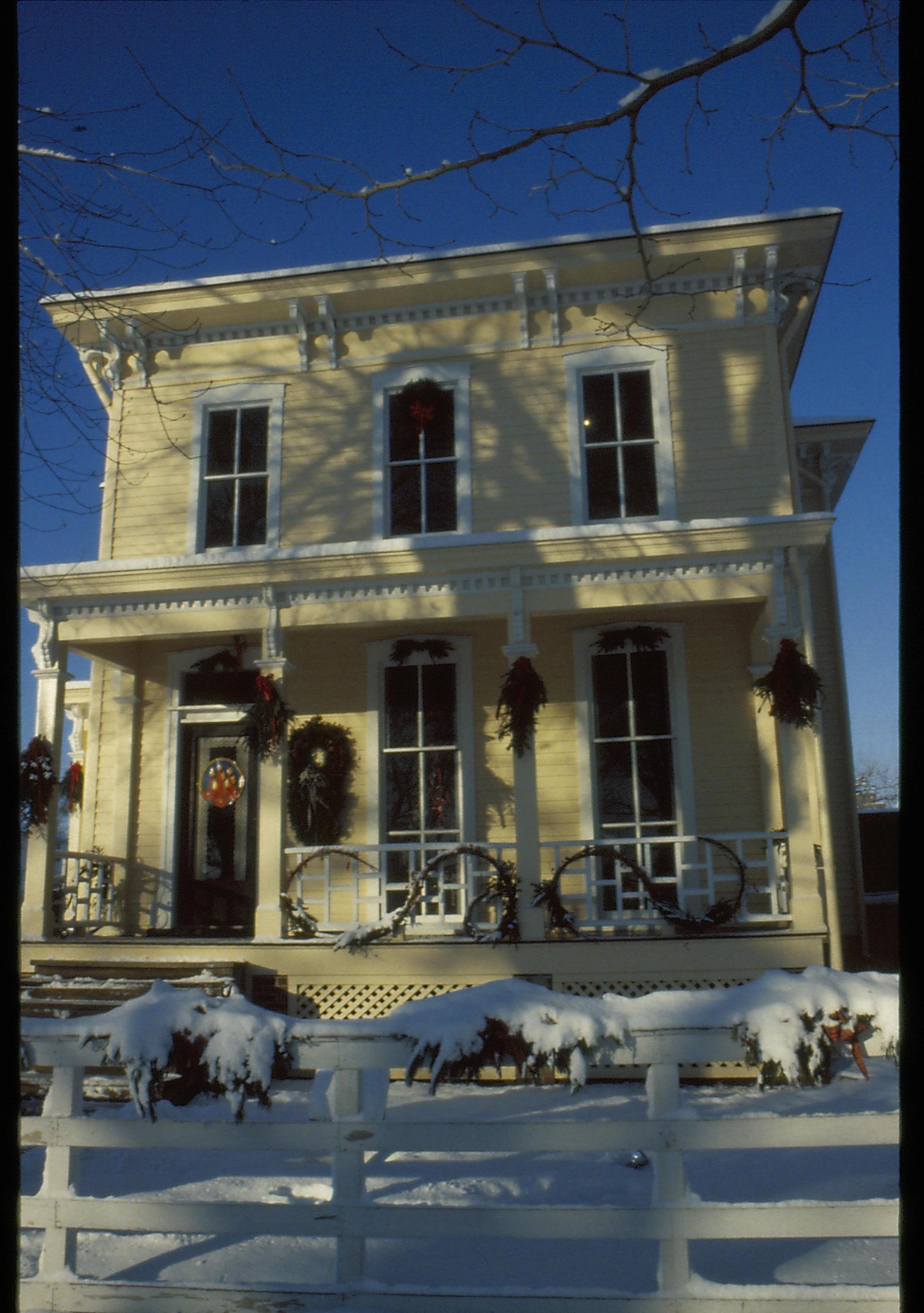 Lincoln Home NHS- Christmas in Lincoln Neighborhood Looking west from boardwalk, east face of Shutt house decorated for Christmas. Christmas, decorations, Shutt, decor, wreath, garland