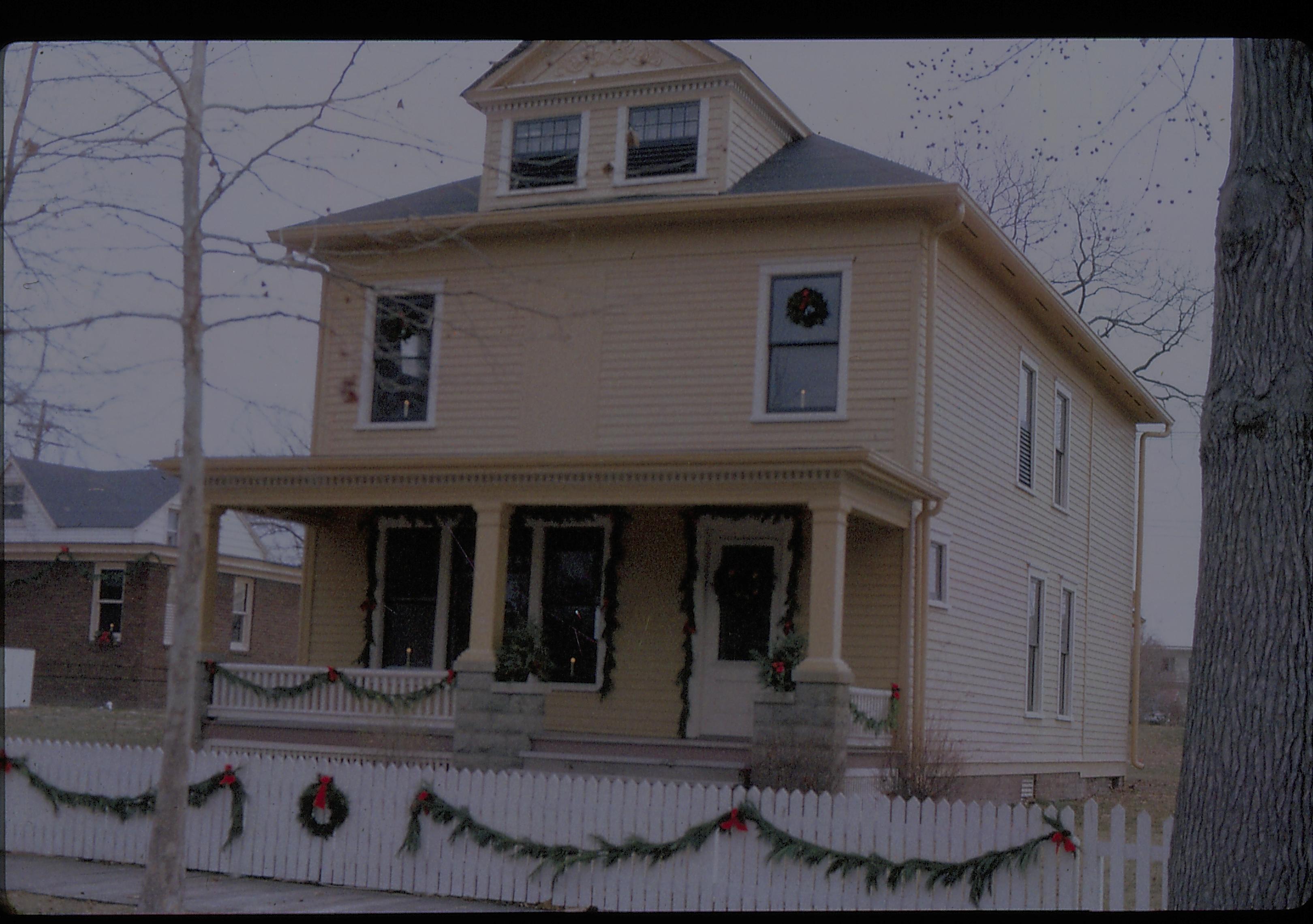 Lincoln Home NHS- Christmas in Lincoln Neighborhood Looking north east from 8th Street, Cook house decorated for Christmas, Arnold in Background. Christmas, decorations, Cook, decor, wreath, garland, Arnold