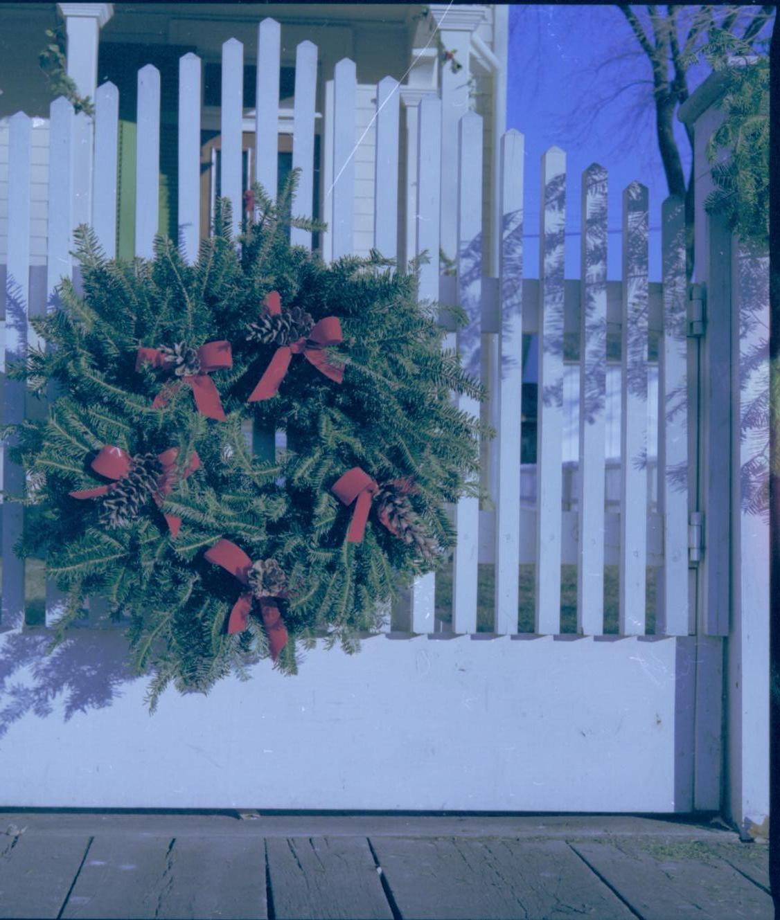 Lincoln Home NHS- Christmas in Lincoln Neighborhood Looking east, wreath hanging on Robinson house gate. Detail. Christmas, decorations, Robinson, gate, fence, wreath, decor