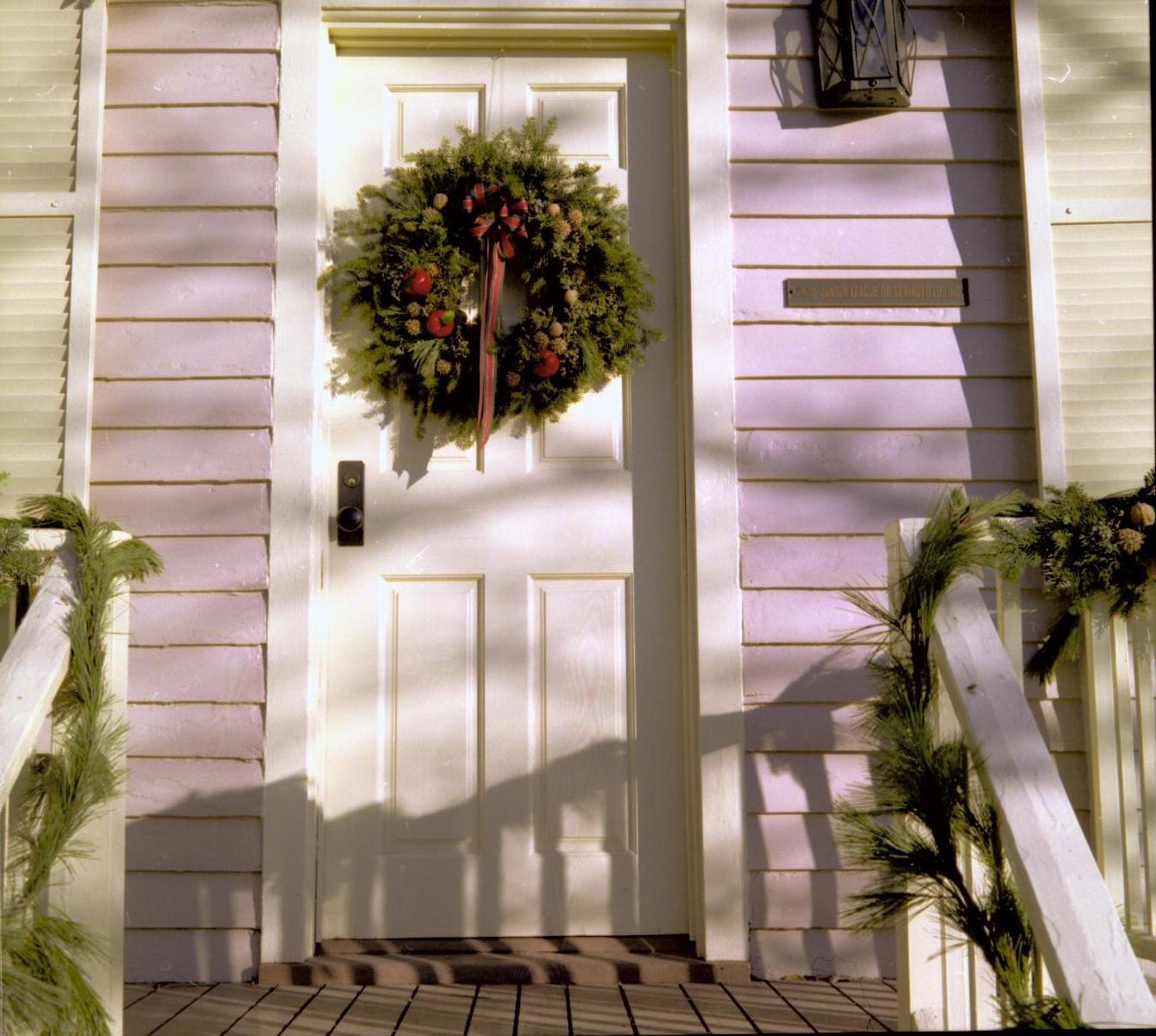 Lincoln Home NHS- Christmas in Lincoln Neighborhood Looking west from steps, Sprigg house door and porch decorated for Christmas. Detail. Christmas, decorations, Sprigg, decor, wreath, garland, door, porch