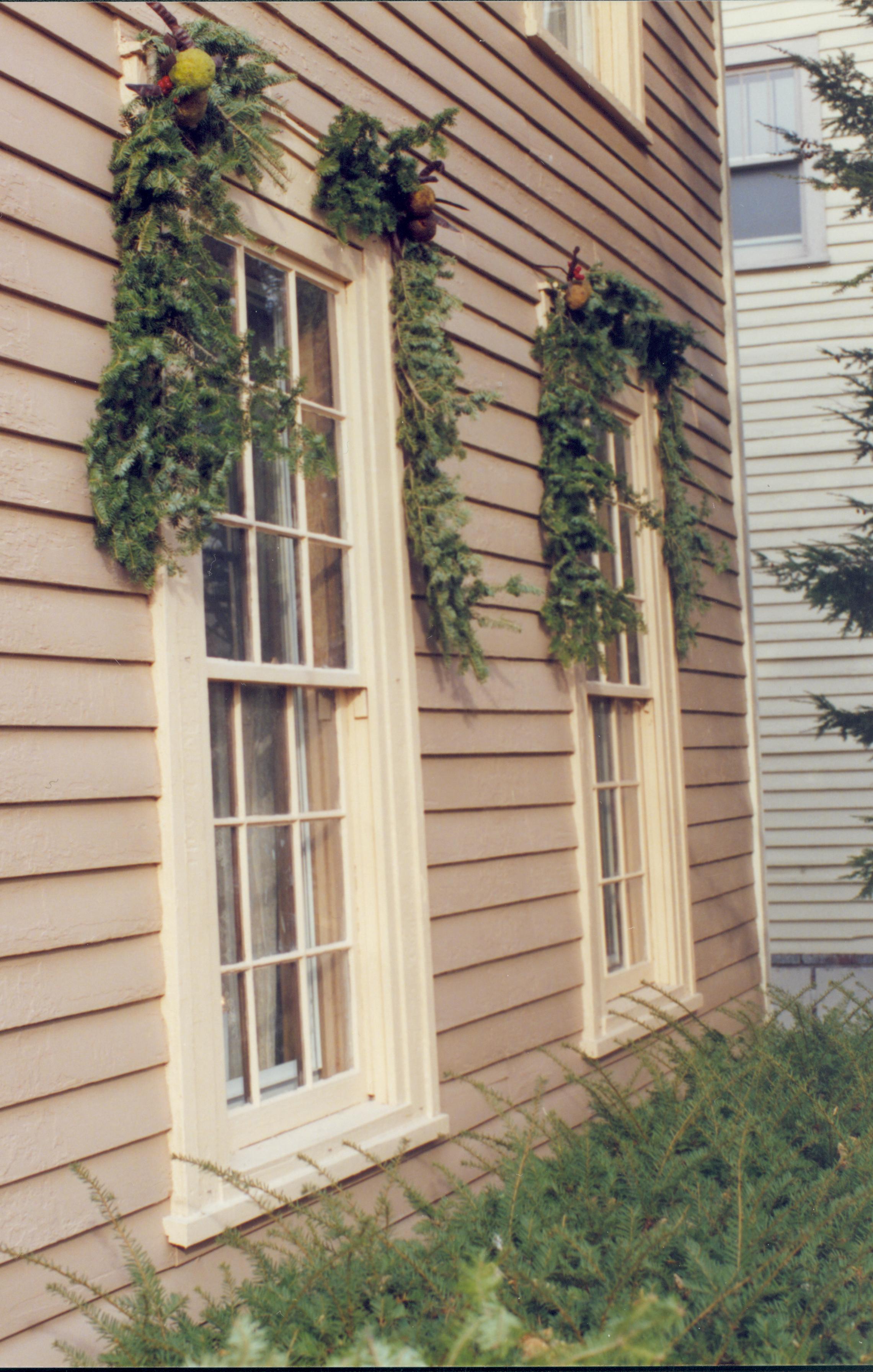 Lincoln Home NHS- Christmas in Lincoln Neighborhood Looking toward decorations on windows of a neighborhood home. Detail. Christmas, neighborhood, decoration, wreath