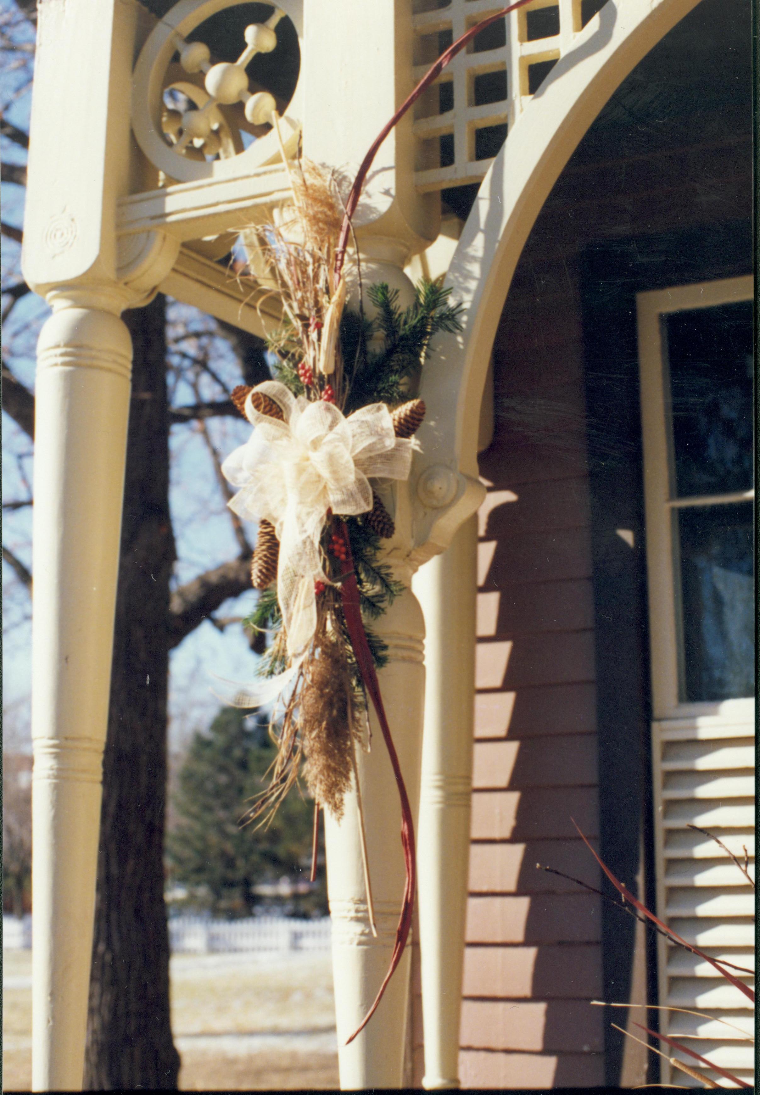 Lincoln Home NHS- Christmas in Lincoln Neighborhood Looking south west, Christmas decor on porch overhang of Dean house. Detail. Christmas, neighborhood, Dean, porch, decor, detail