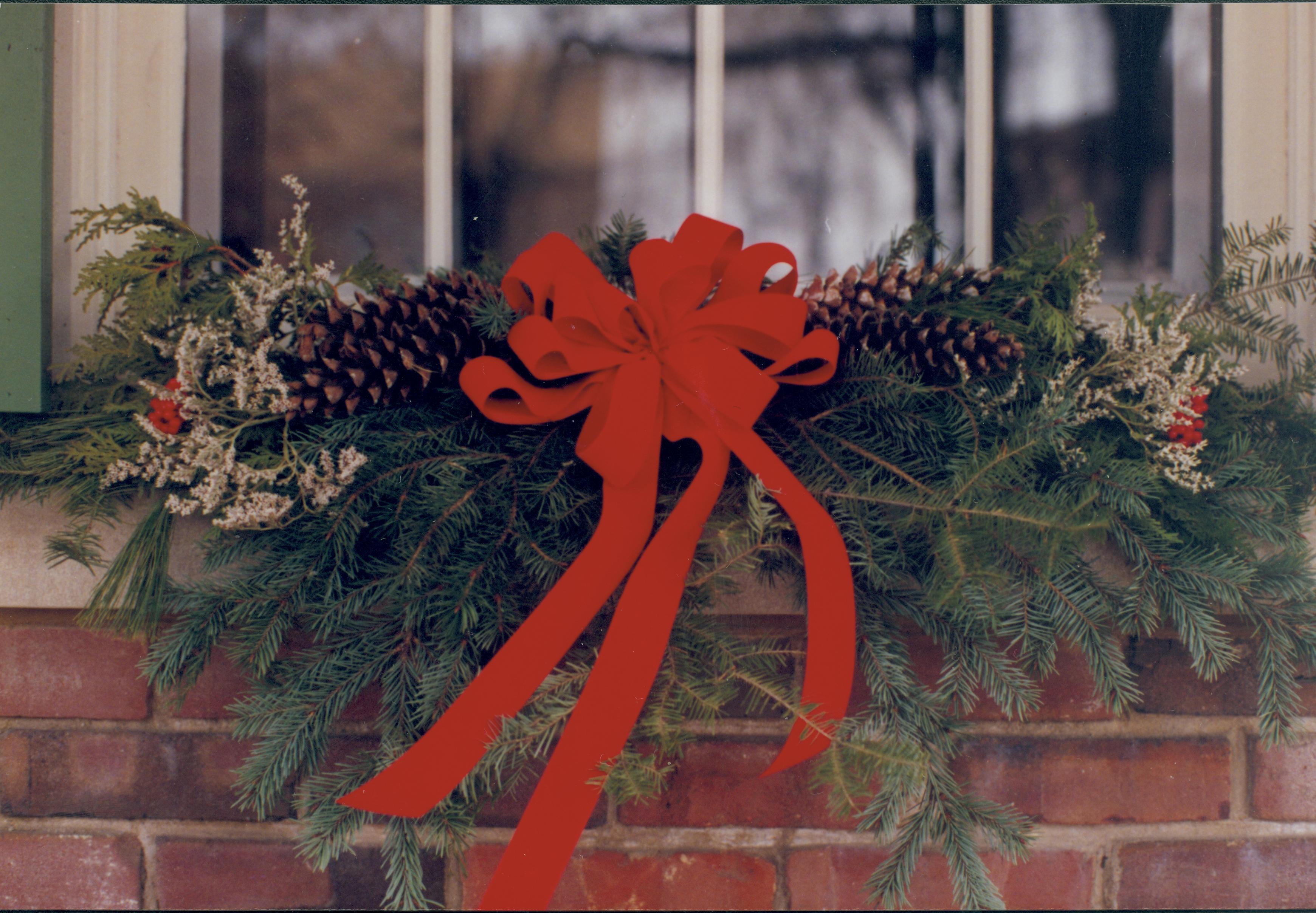 Lincoln Home NHS- Christmas in Lincoln Neighborhood Detail shot of evergreen on window sill. Detail. Christmas, neighborhood, decoration, detail