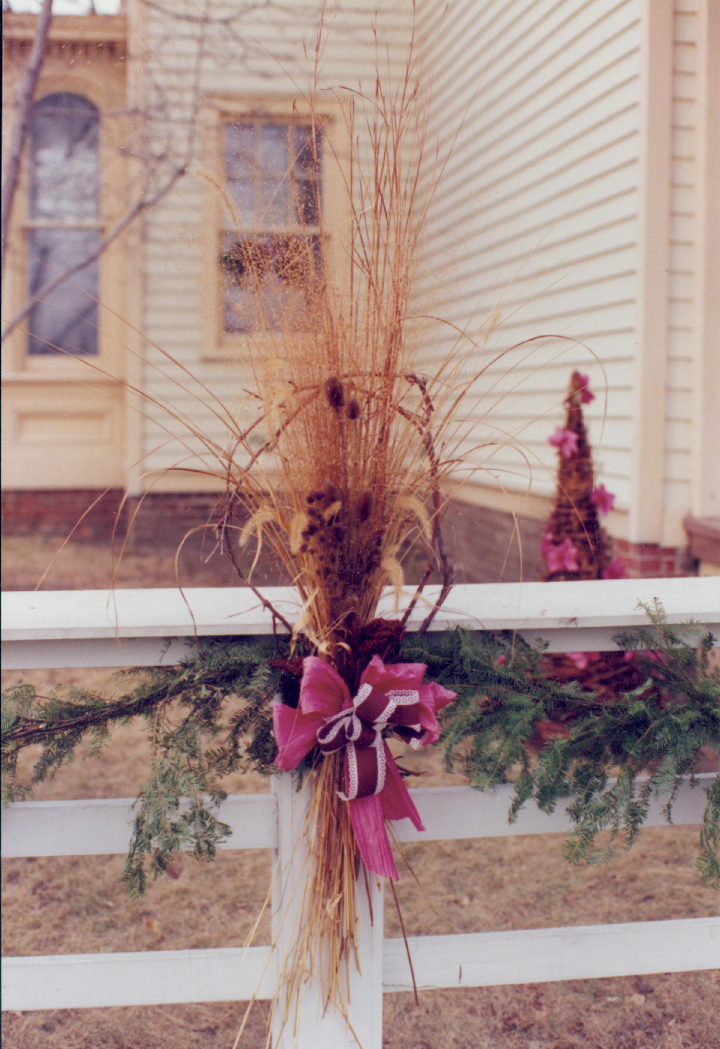 Lincoln Home NHS- Christmas in Lincoln Neighborhood Looking west, Christmas garland on fence of Shutt house. Detail. Christmas, neighborhood, Shutt, garland, fence