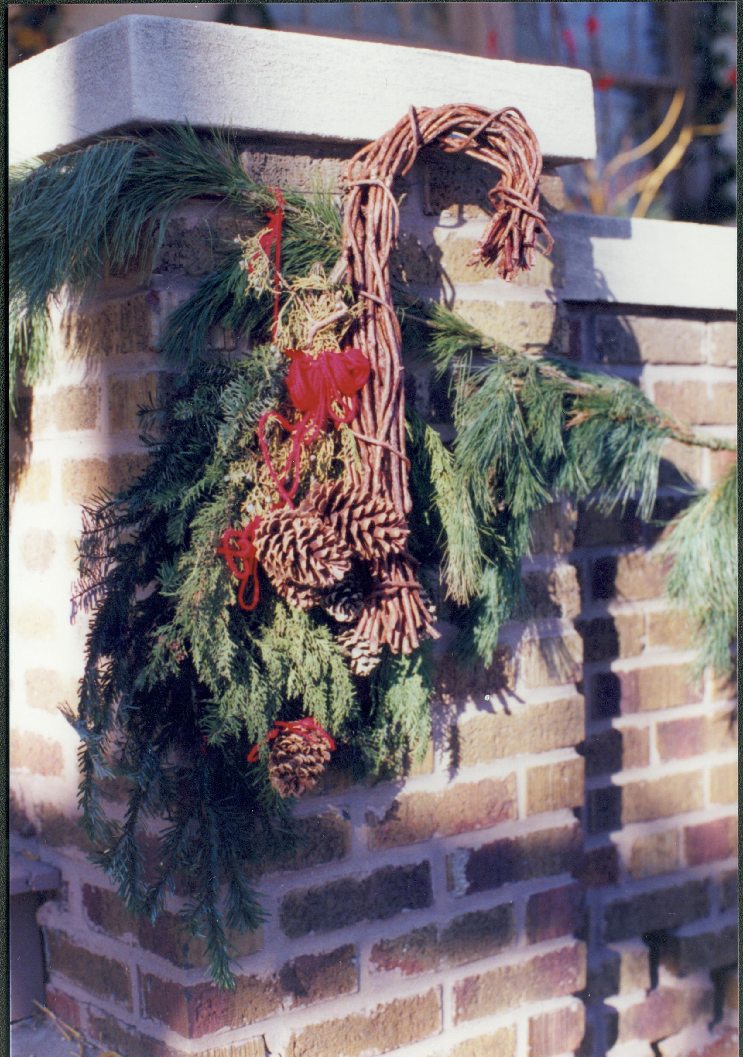 Lincoln Home NHS- Christmas in Lincoln Neighborhood Christmas garland on brick wall. Detail. Christmas, neighborhood, wall, brick, garland, detail