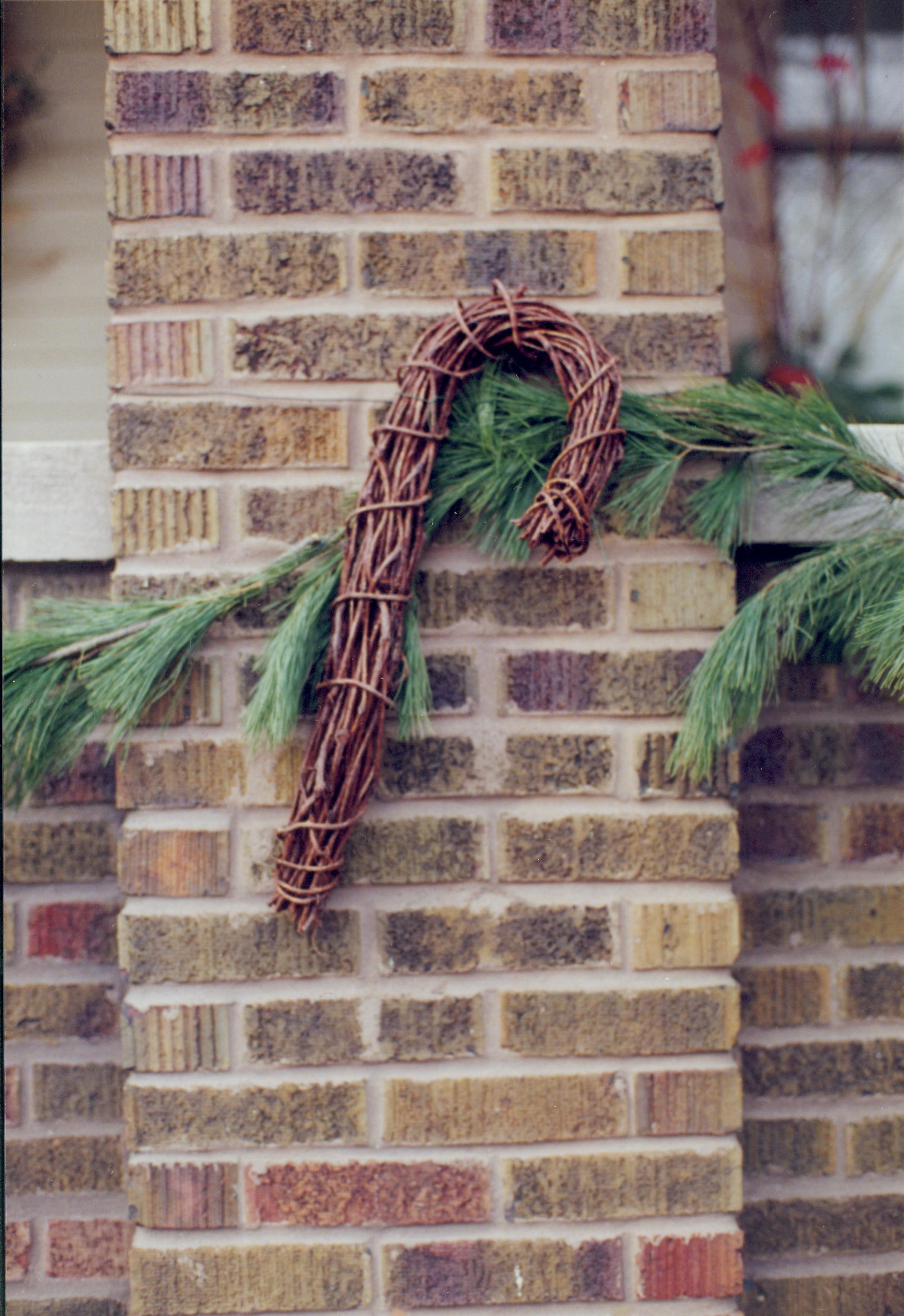 Lincoln Home NHS- Christmas in Lincoln Neighborhood Christmas garland on brick wall of home. Detail. Christmas, neighborhood, wall, brick, garland, detail