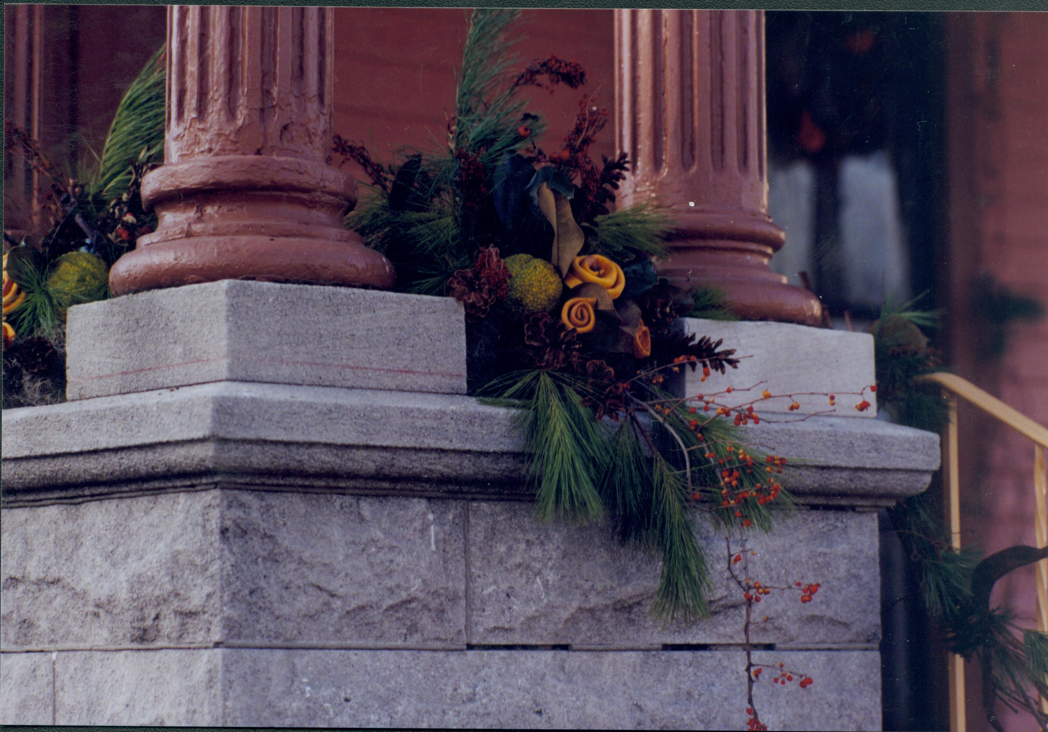 Lincoln Home NHS- Christmas in Lincoln Neighborhood Christmas decor and garland on porch wall. Detail. Christmas, neighborhood, decor, garland, detail