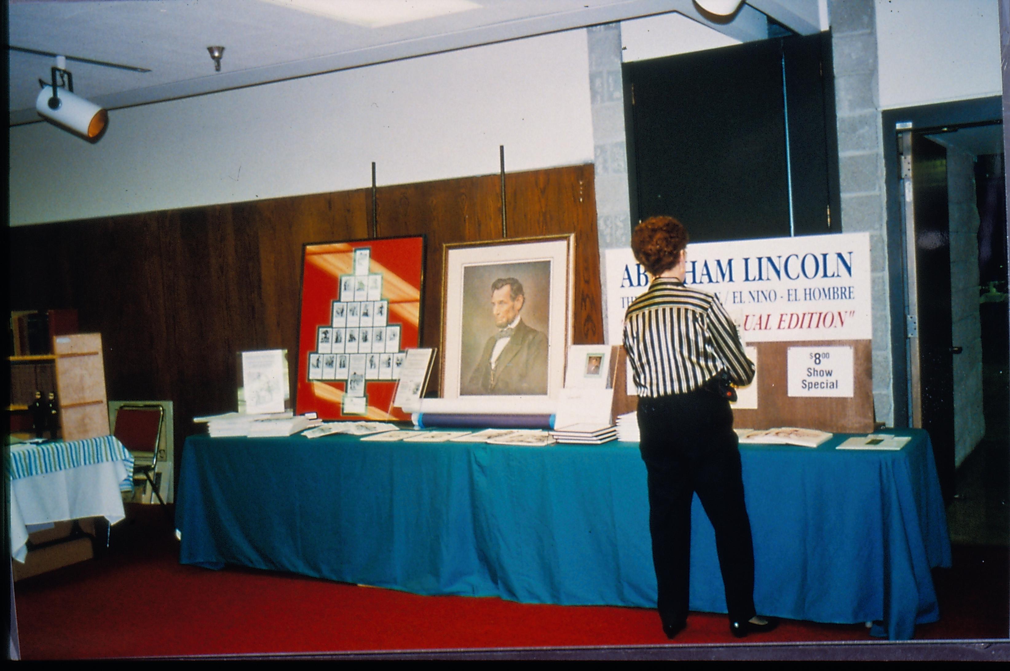 Display table with large Lincoln portrait 1997 Colloq (color slides) Colloquium, 1997