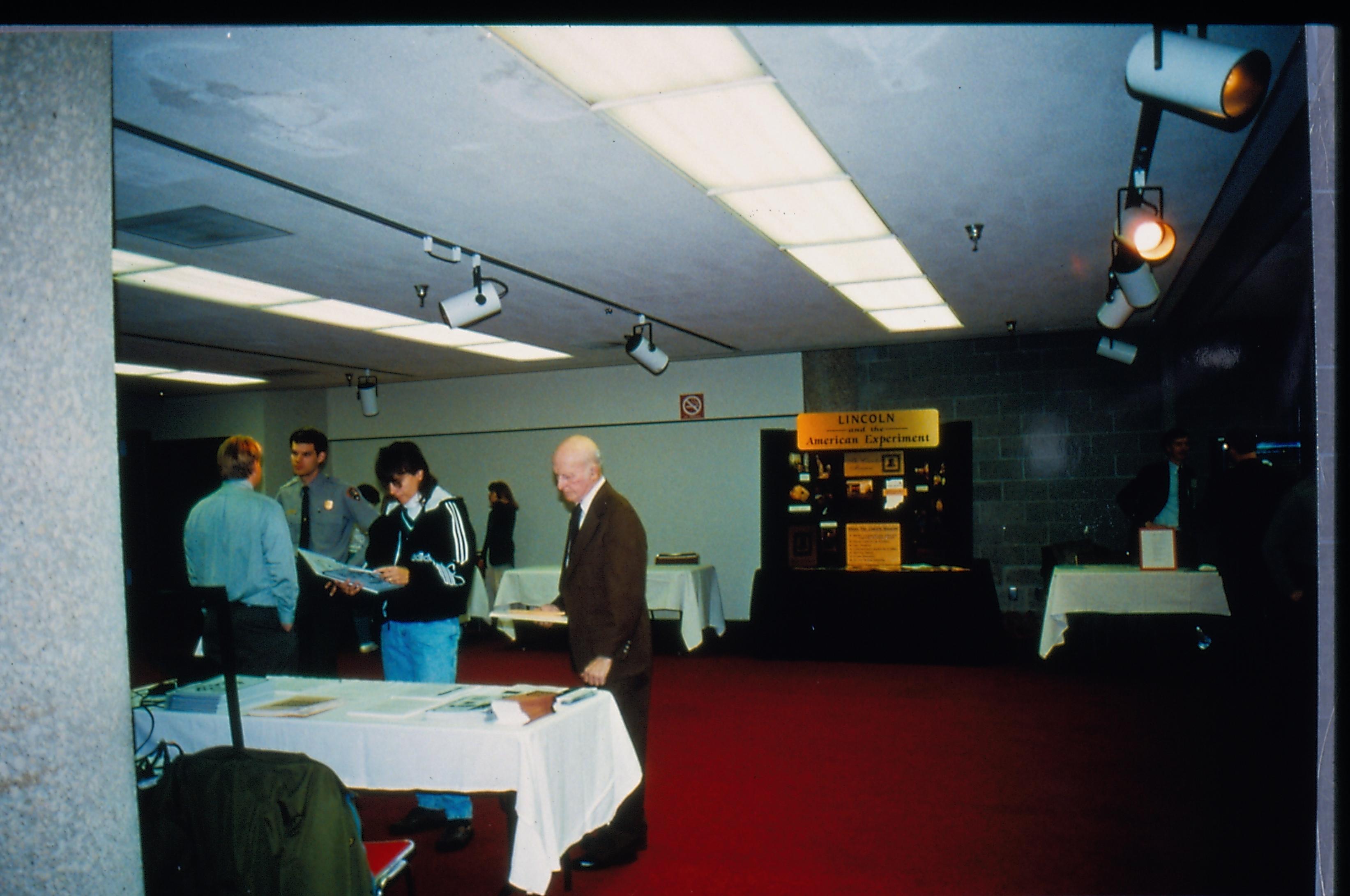 Attendees at literature table. 1997 Colloq (color slides) Colloquium, 1997