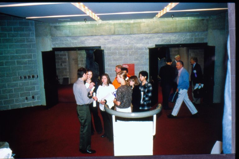 Ranger with school group outside theater. 1997 Colloq (color slides) Colloquium, 1997