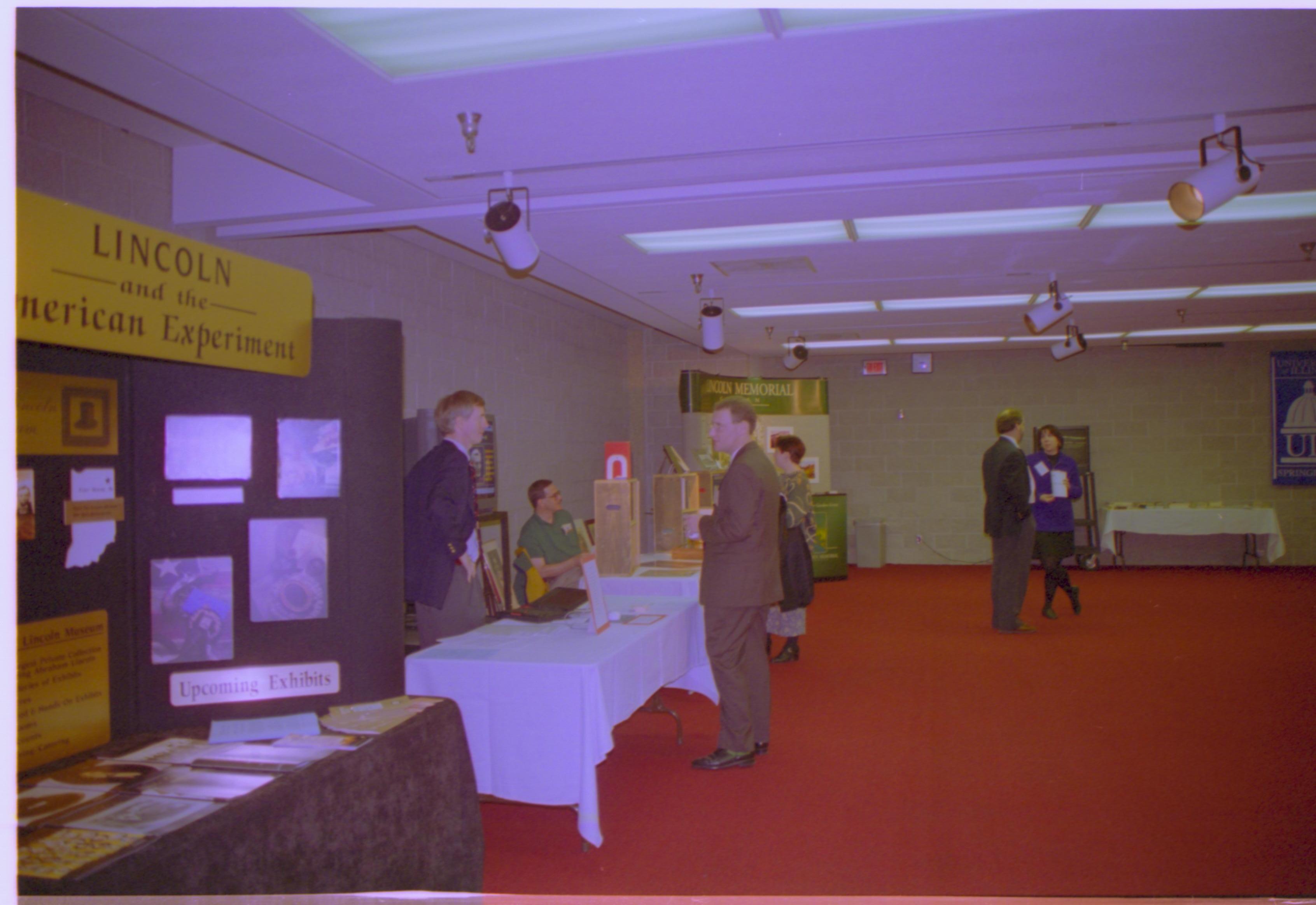 Attendees in exhibit area. 4-1997 Colloq (color); 3 Colloquium, 1997