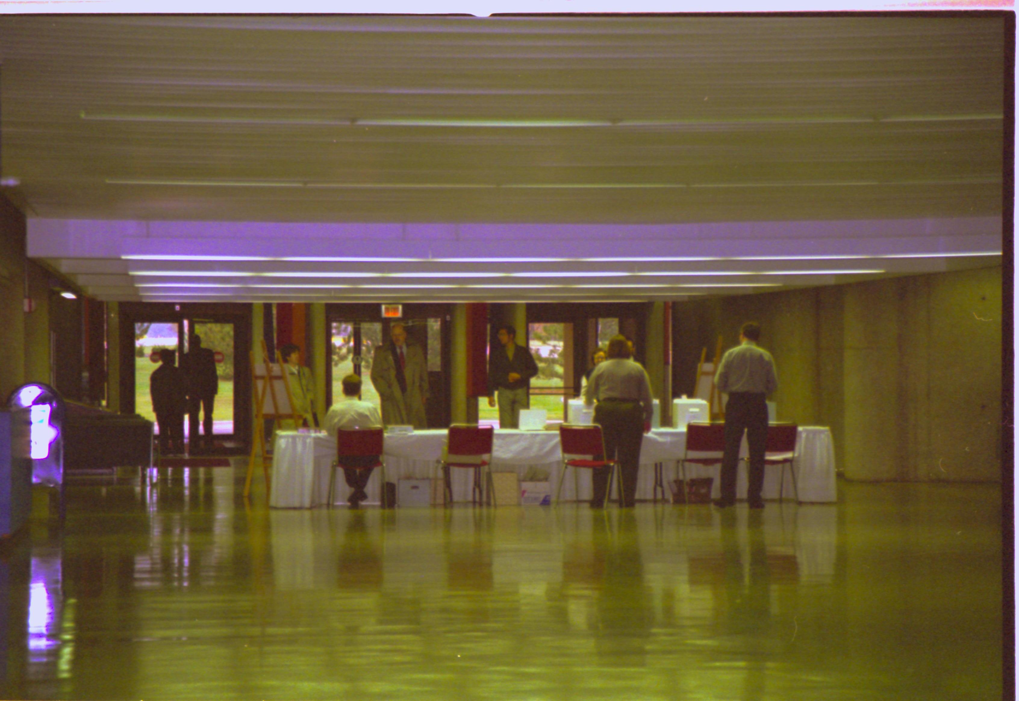 LIHO staff at check-in desk 4-1997 Colloq (color); 8 Colloquium, 1997