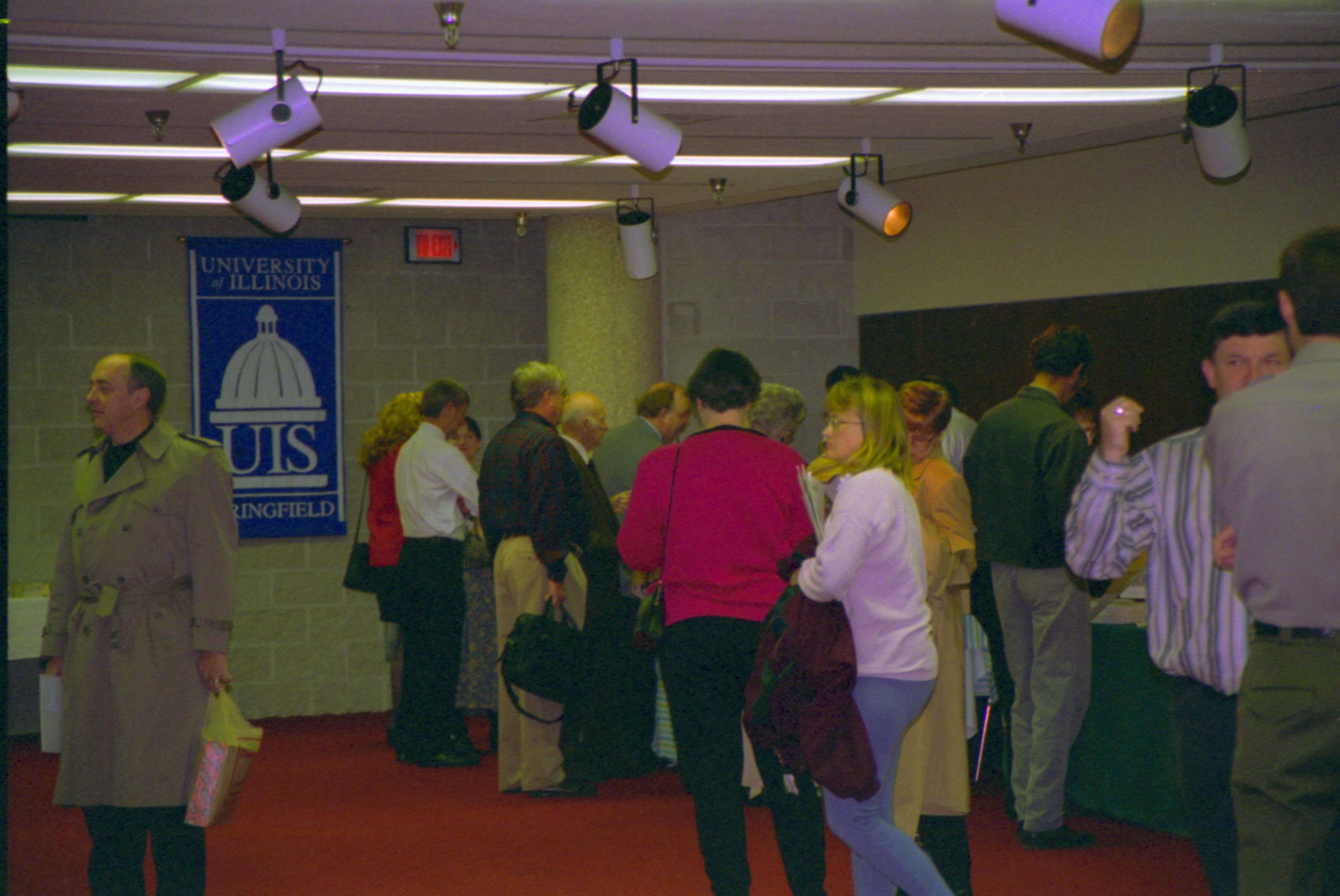 Guests browsing in exhibit area. 4-1997 Colloq (color); 9 Colloquium, 1997