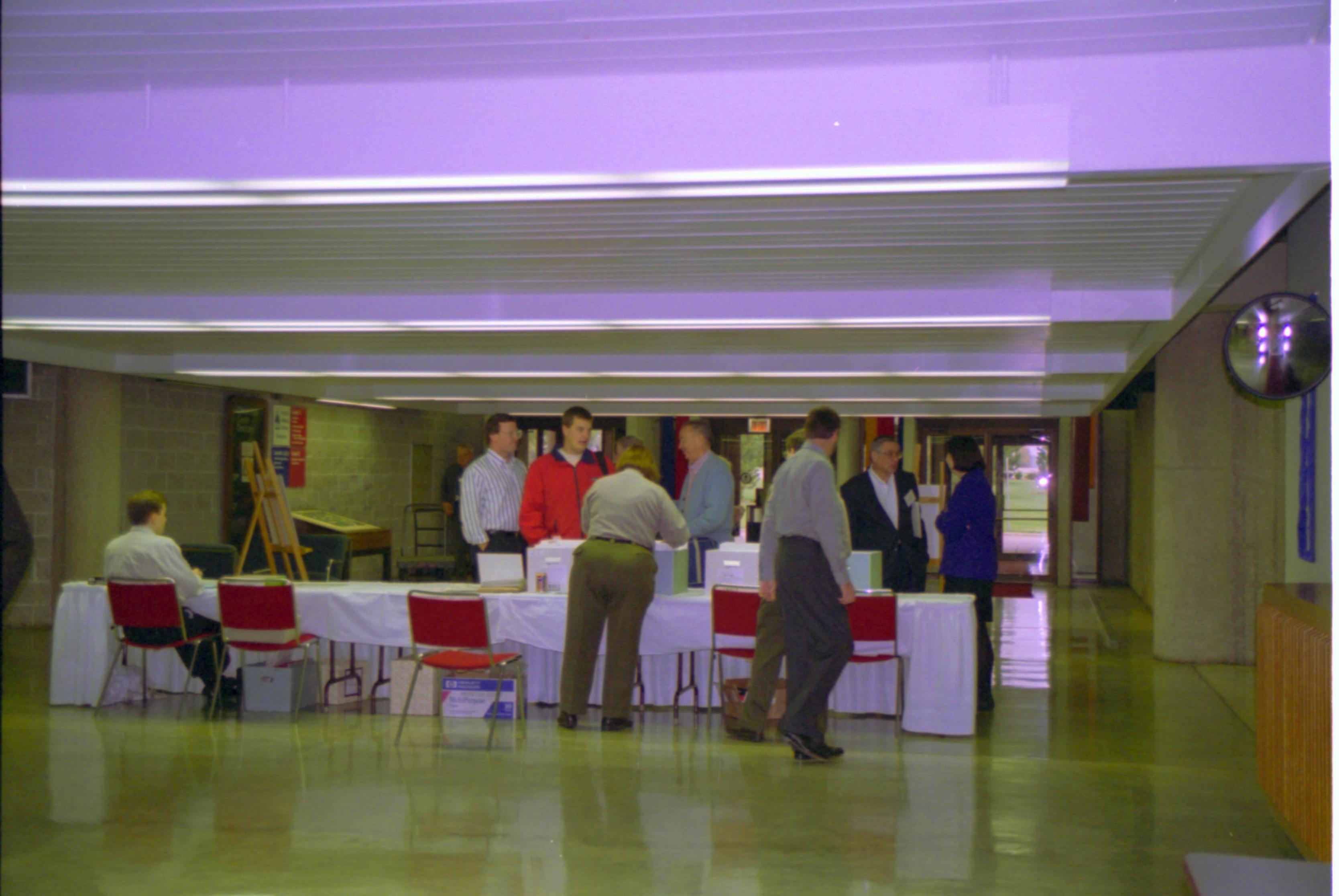 LIHO staff @ check-in desk 4-1997 Colloq (color); 13 Colloquium, 1997