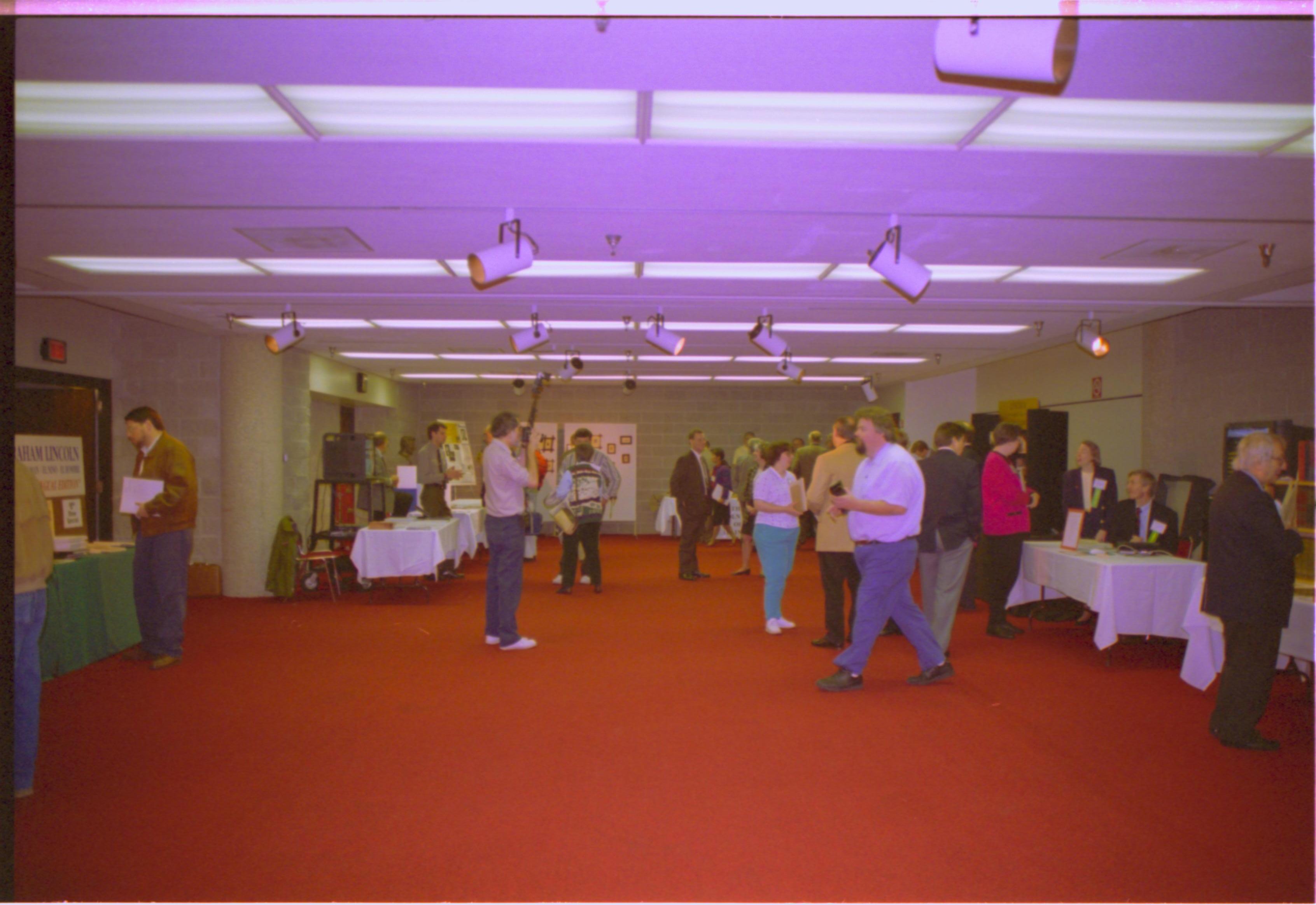 Attendees browsing in exhibit area. 4-1997 Colloq (color); 13 Colloquium, 1997