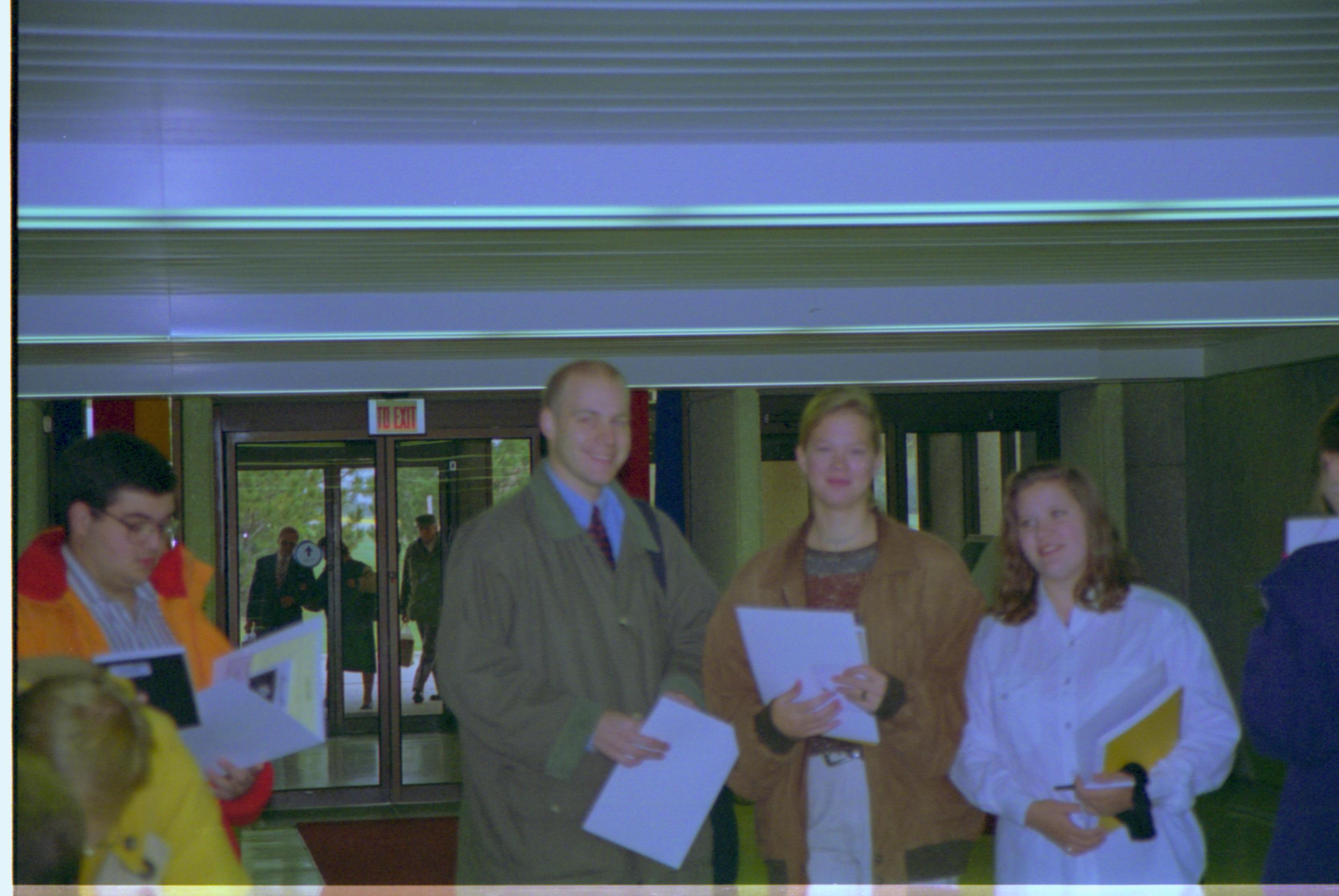 Attendees check in. 4-1997 Colloq (color); 25 Colloquium, 1997