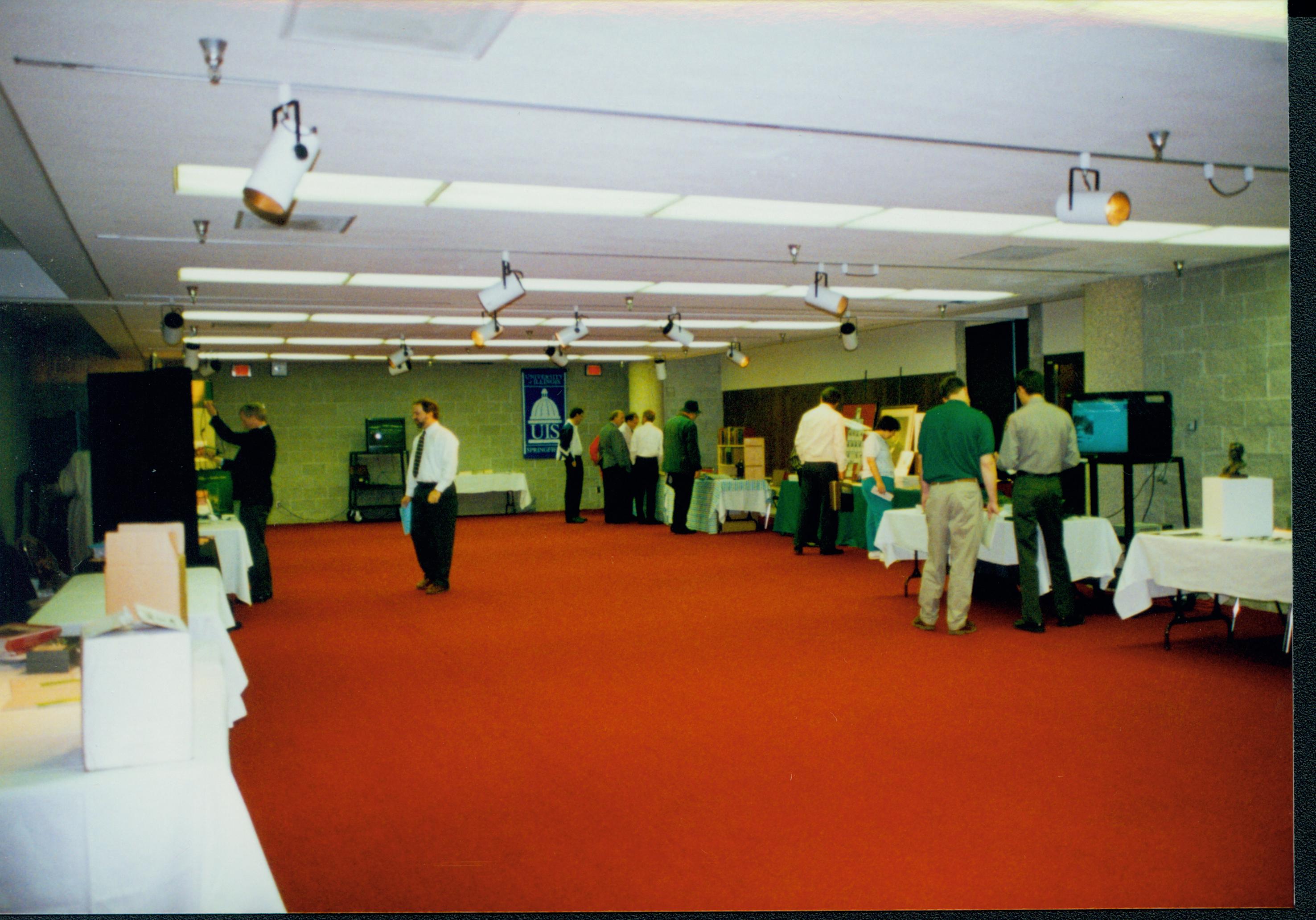 Attendees in exhibit area. 5-1997 Colloq (color); 29 Colloquium, 1997