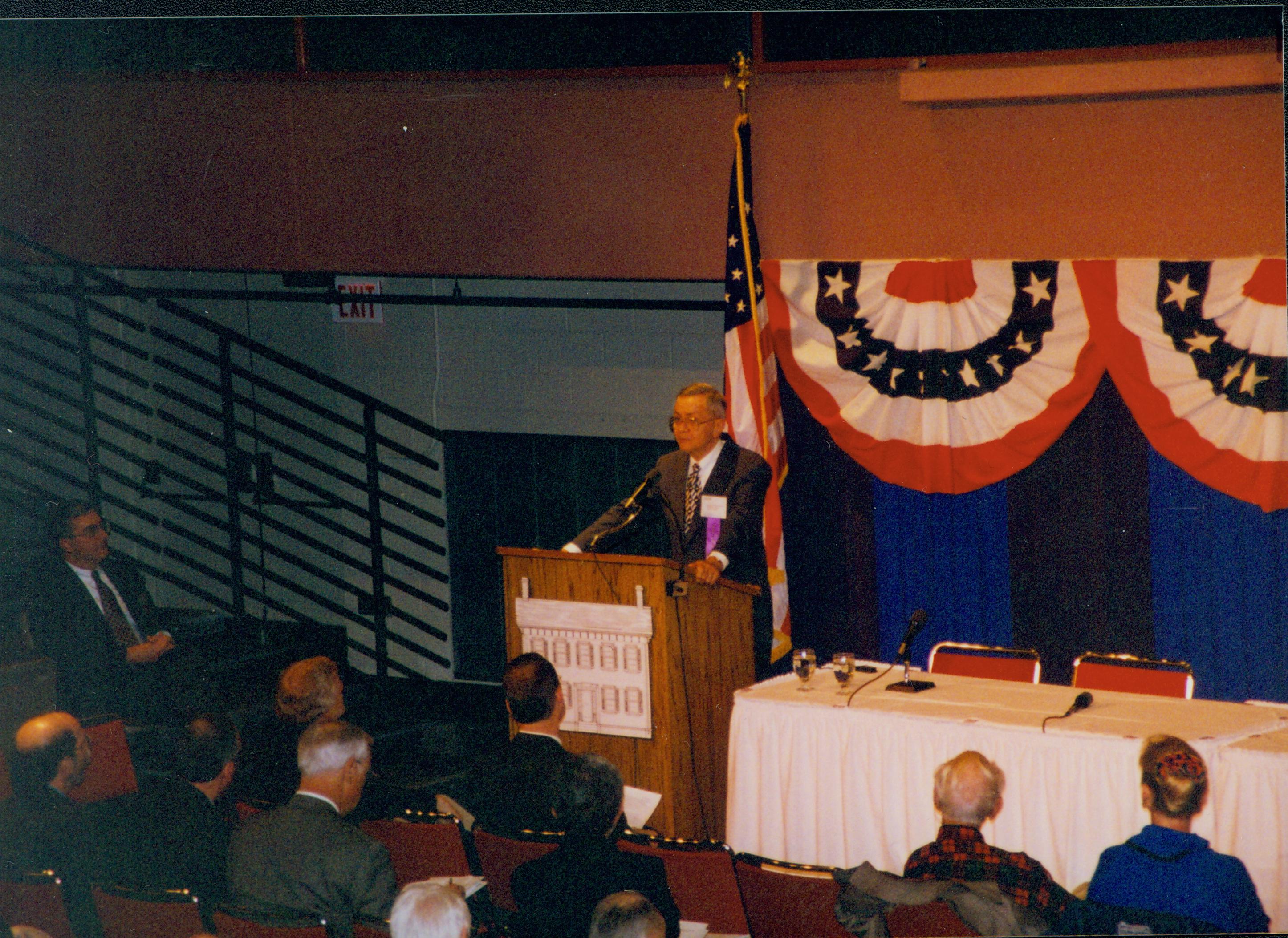 Speaker at podium. 1-1997 Colloq (color); 20 Colloquium, 1997