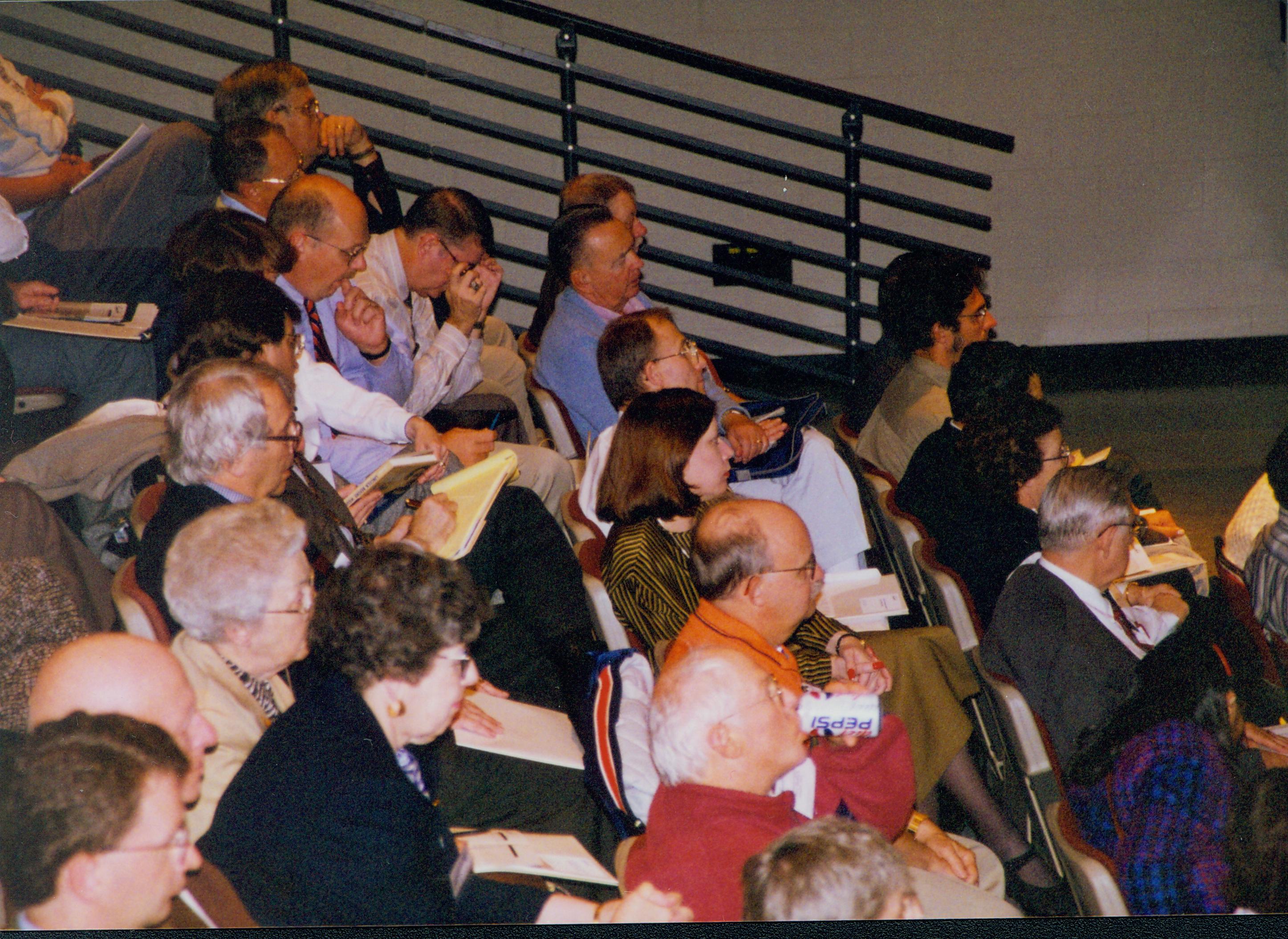  Guests seated on risers. 1-1997 Colloq (color); 22 Colloquium, 1997