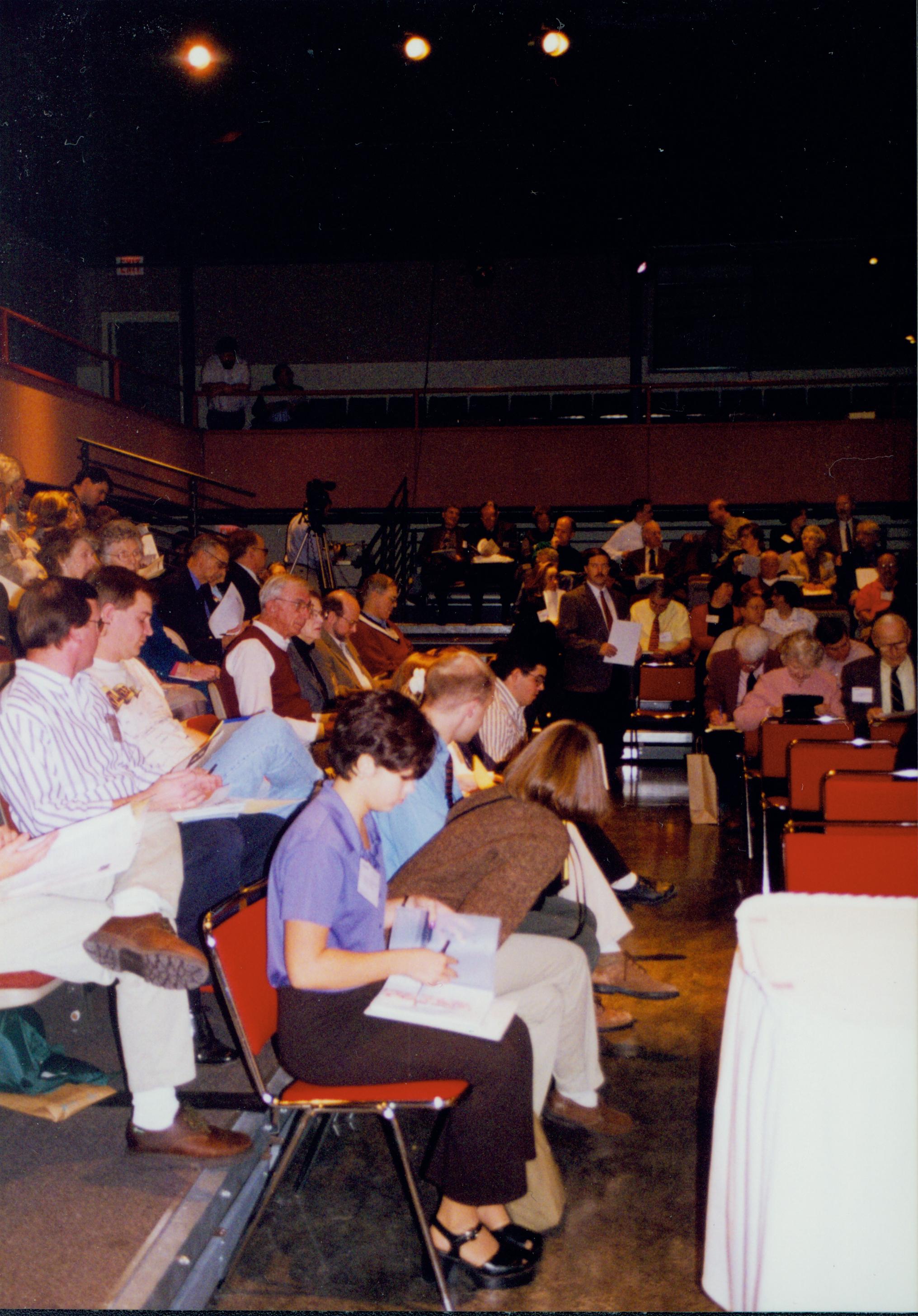 High School guests and participants seated in lecture room. 1-1997 Colloq (color); 3 Colloquium, 1997